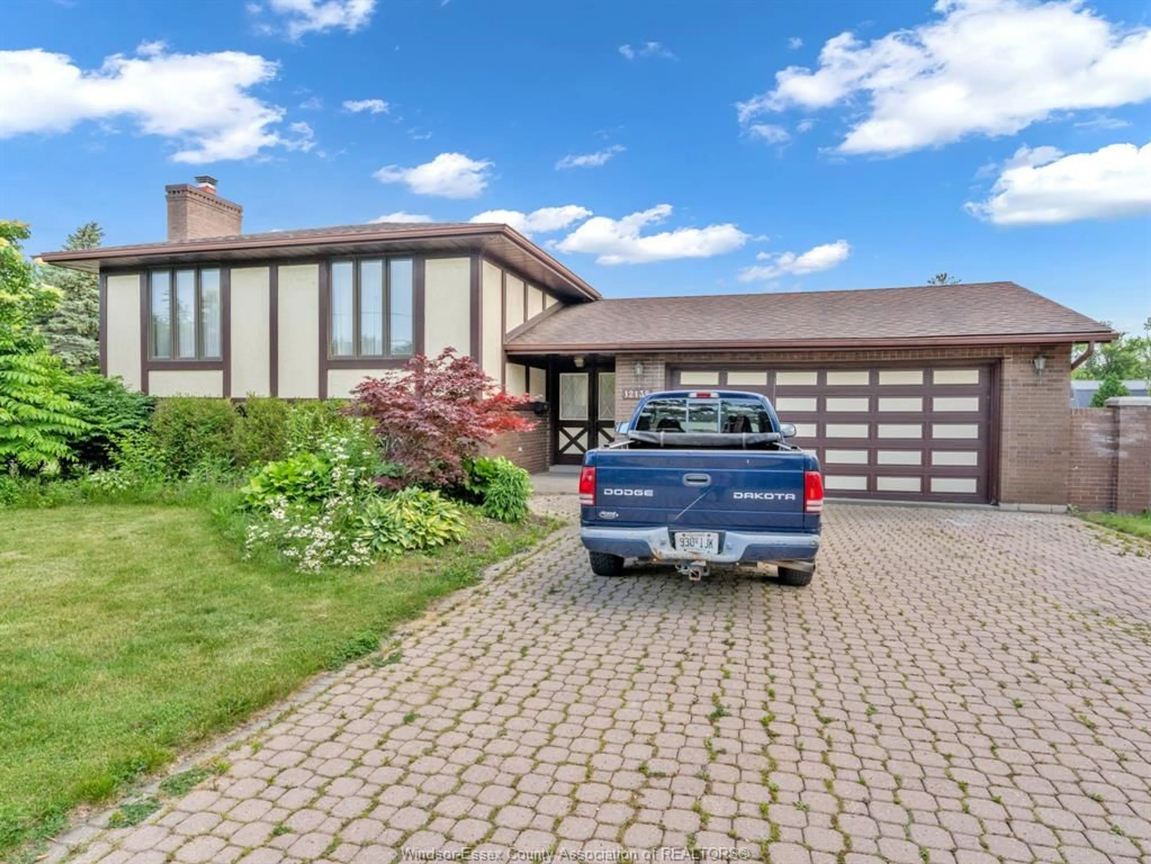 Home with brick exterior material, street for 12135 INTERSECTION Rd, Tecumseh Ontario N8N 1R4