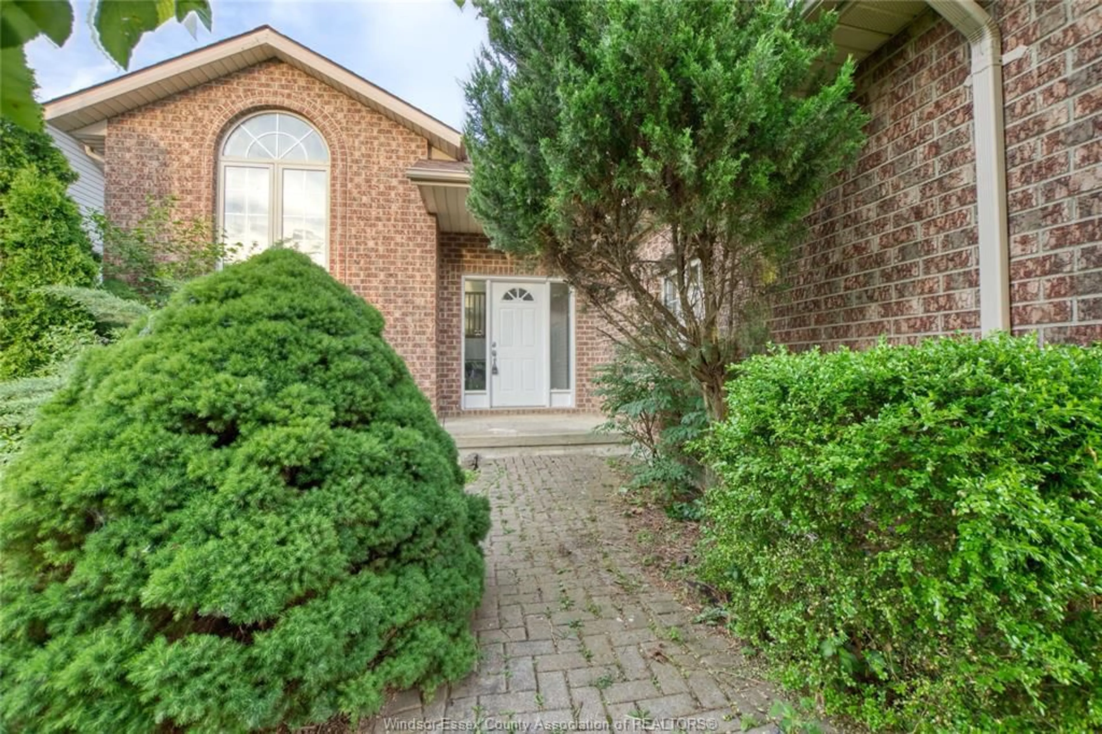 Home with brick exterior material, street for 248 WILLOWWOOD Dr, Lakeshore Ontario N0R 1A0