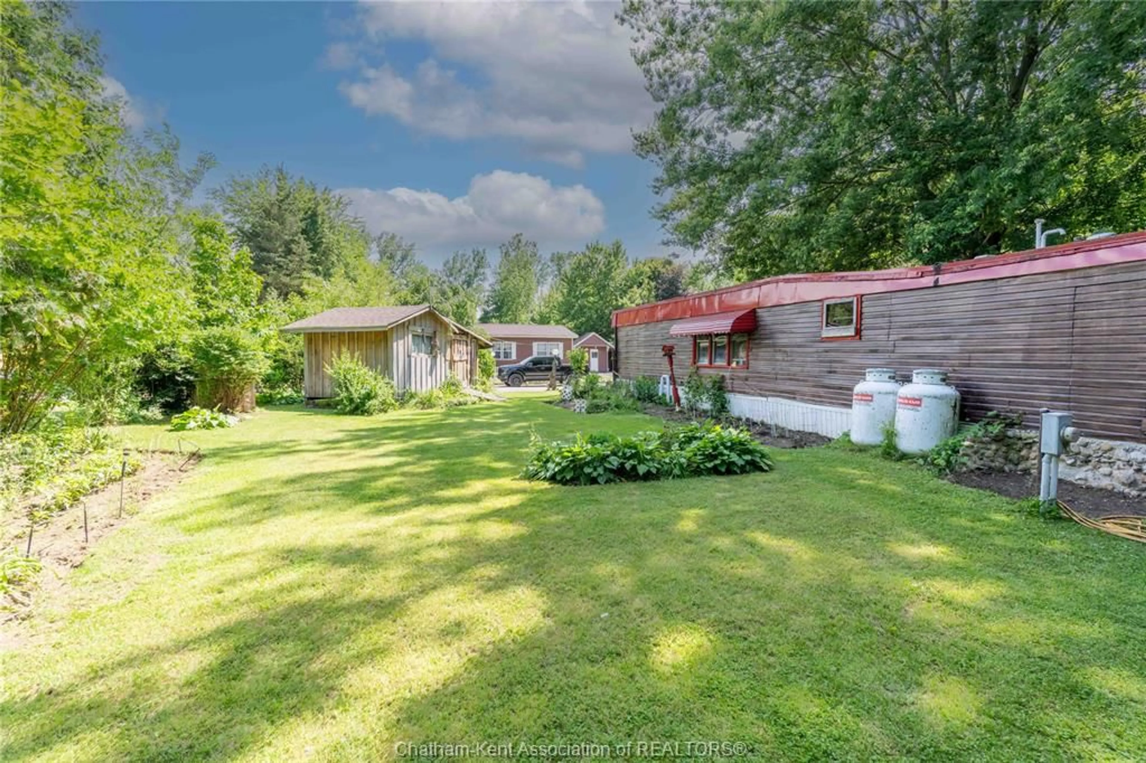 A pic from outside/outdoor area/front of a property/back of a property/a pic from drone, unknown for 29338 Jane Rd #52, Thamesville Ontario N0P 2K0