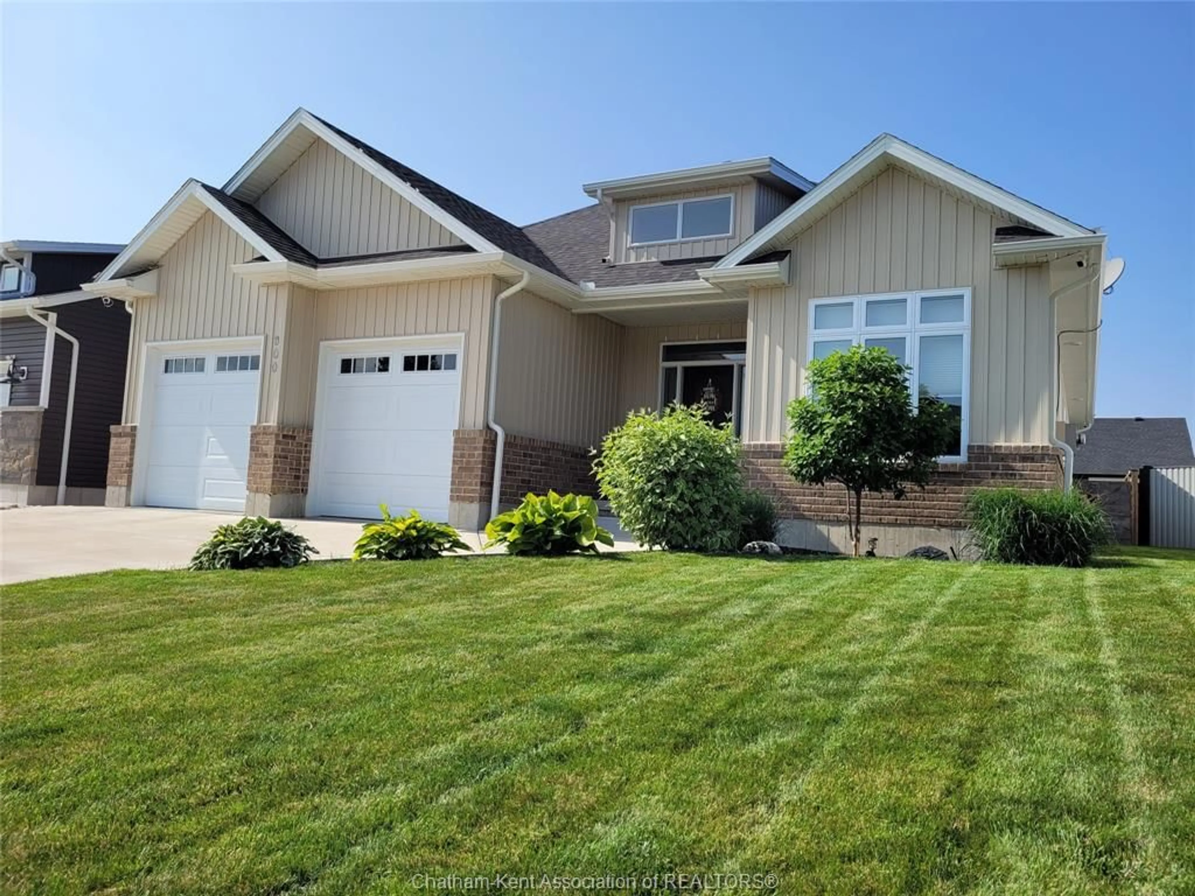 Home with vinyl exterior material, street for 300 DAVIES St, Dresden Ontario N0P 1M0