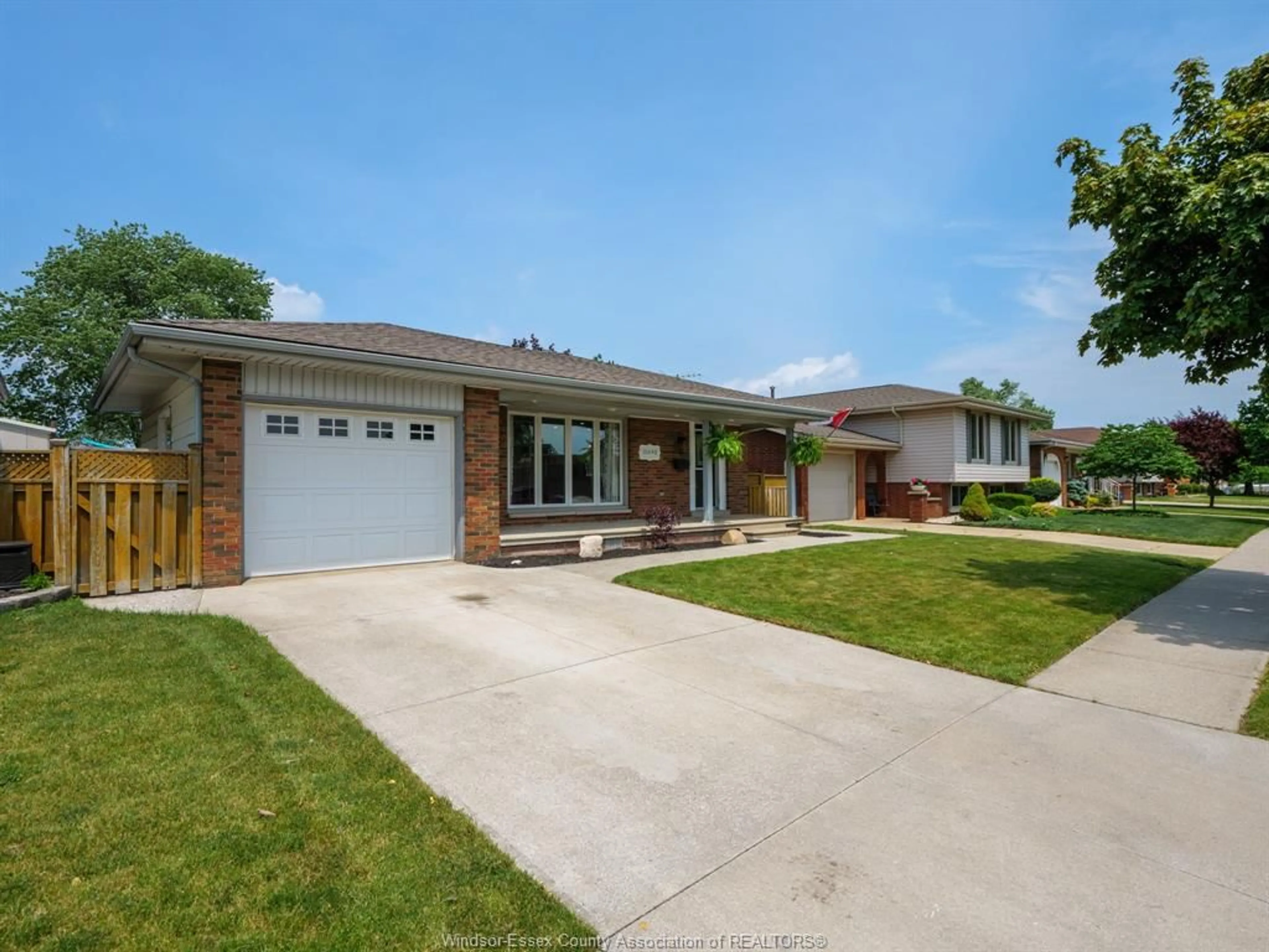 Home with brick exterior material, street for 10690 Eastcourt Dr, Windsor Ontario N8R 1E8