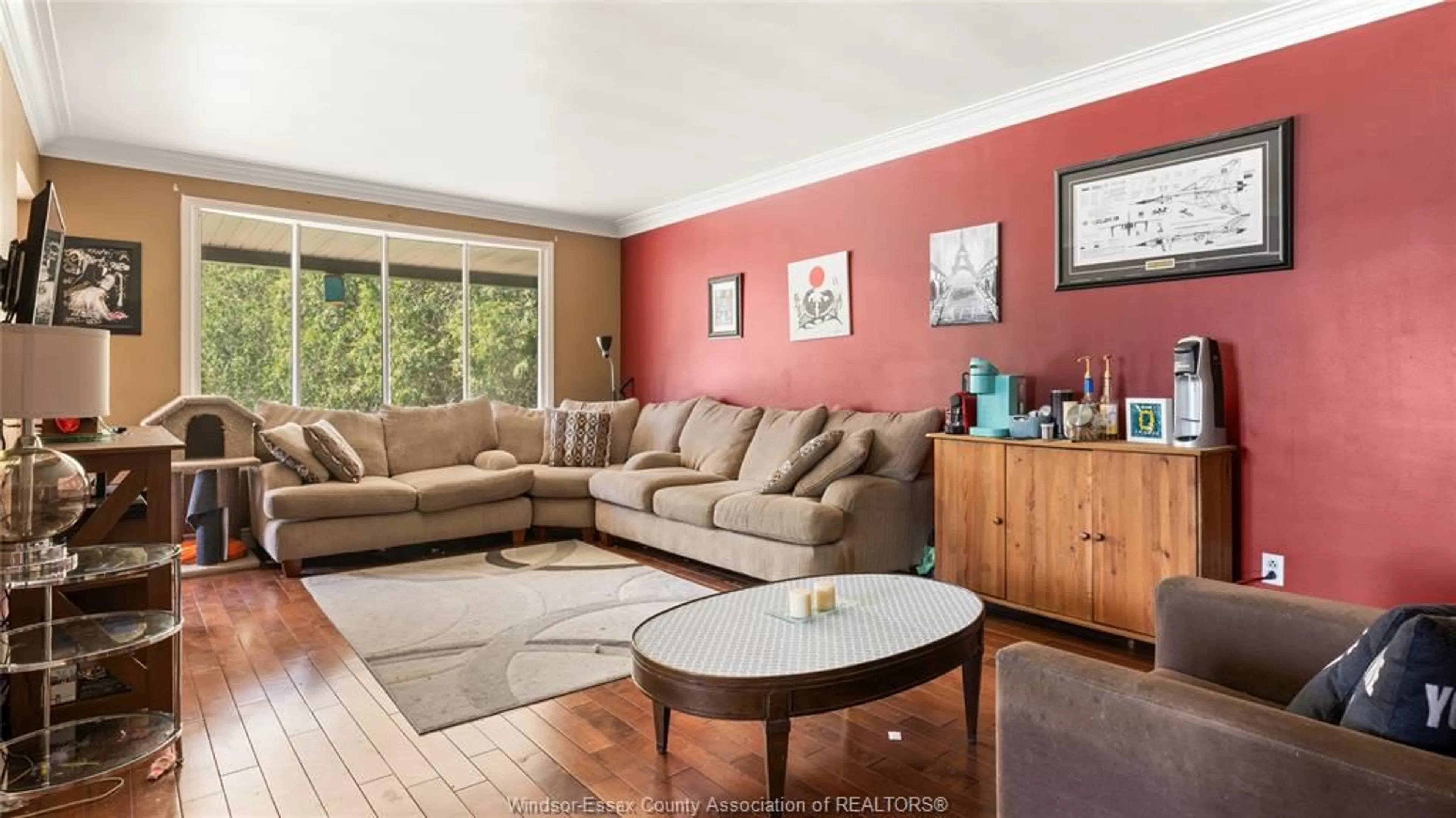 Living room with furniture, wood/laminate floor for 5097 MALDEN Rd, Windsor Ontario N9E 3V1