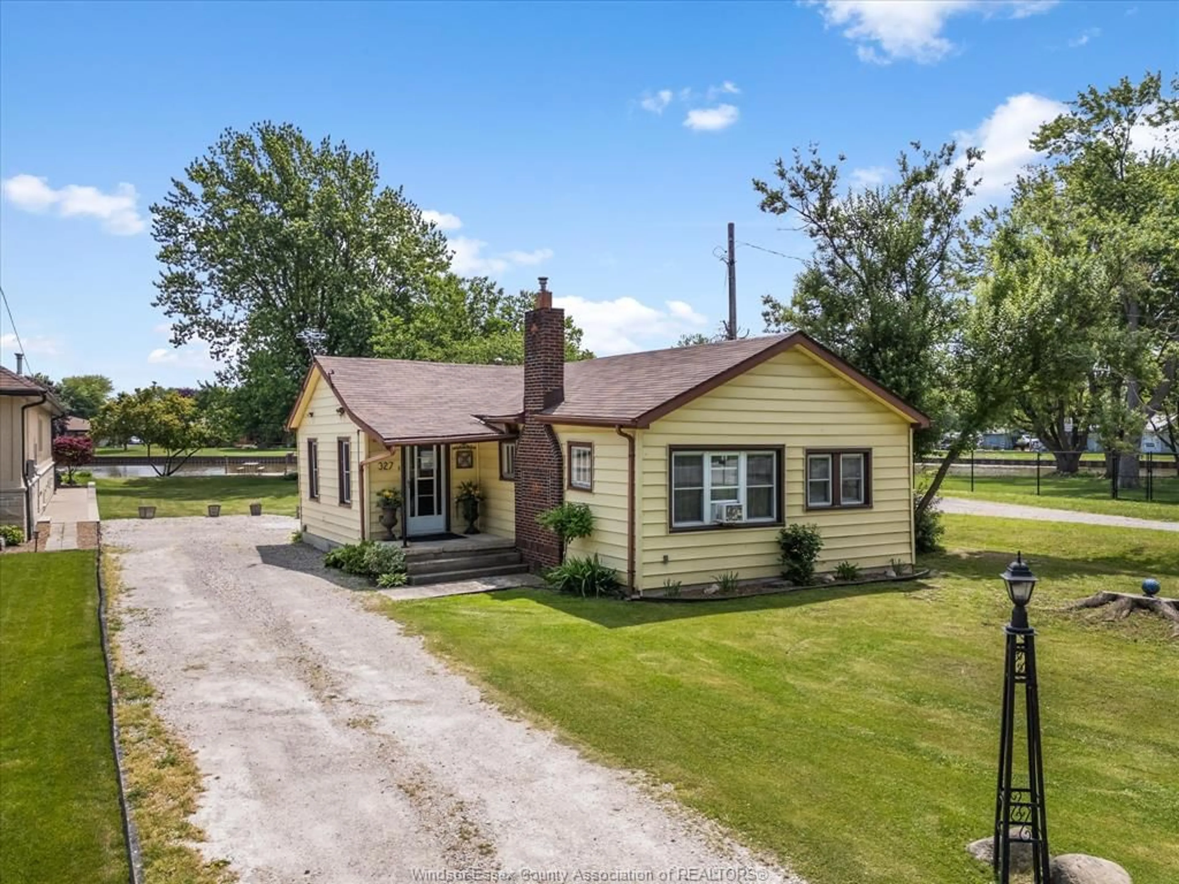 A pic from outside/outdoor area/front of a property/back of a property/a pic from drone, unknown for 327 W. BELLE RIVER Rd, Lakeshore Ontario N8L 1E4
