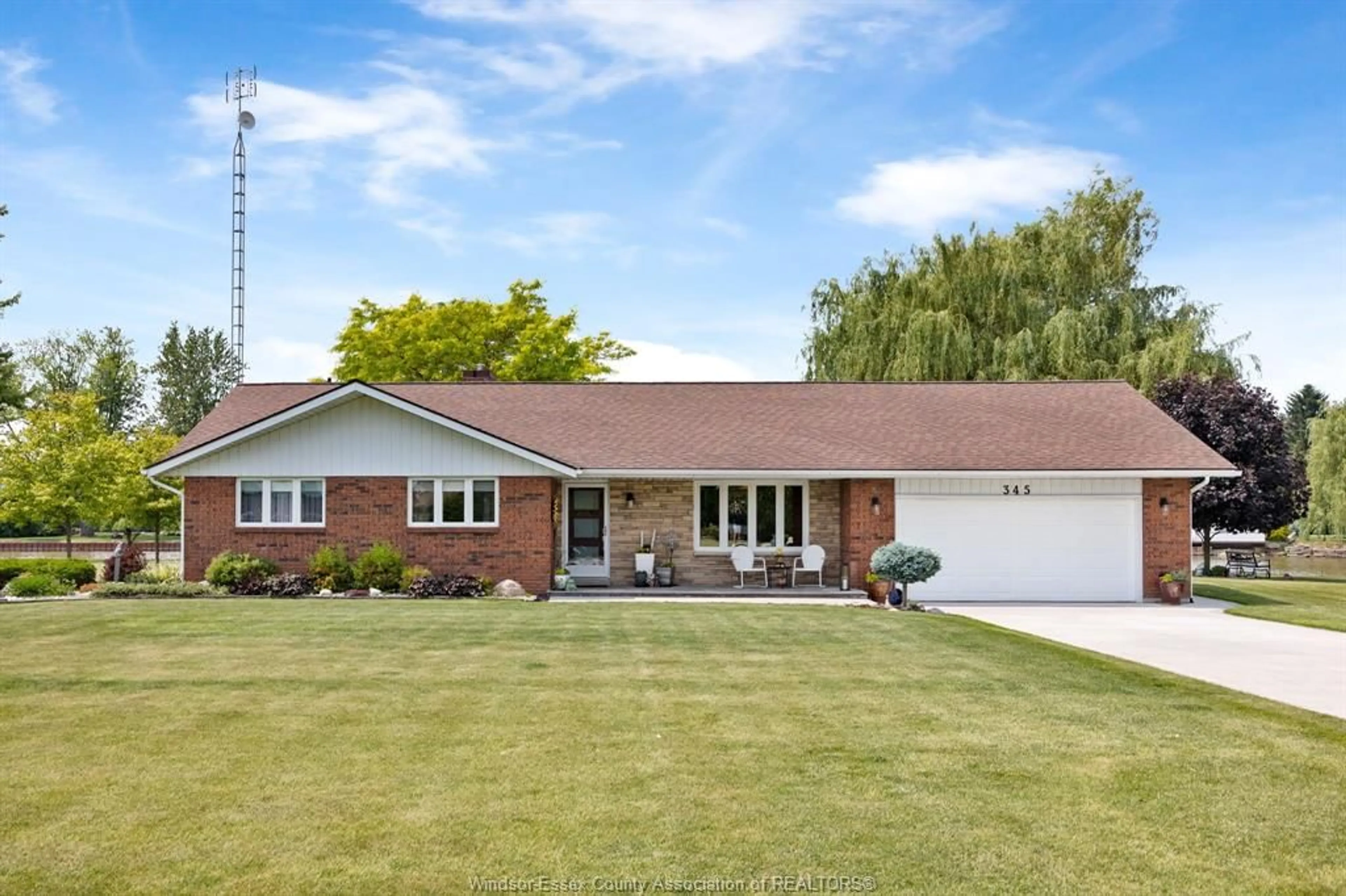Home with brick exterior material, street for 345 HONEY Lane, Lakeshore Ontario N0R 1S0