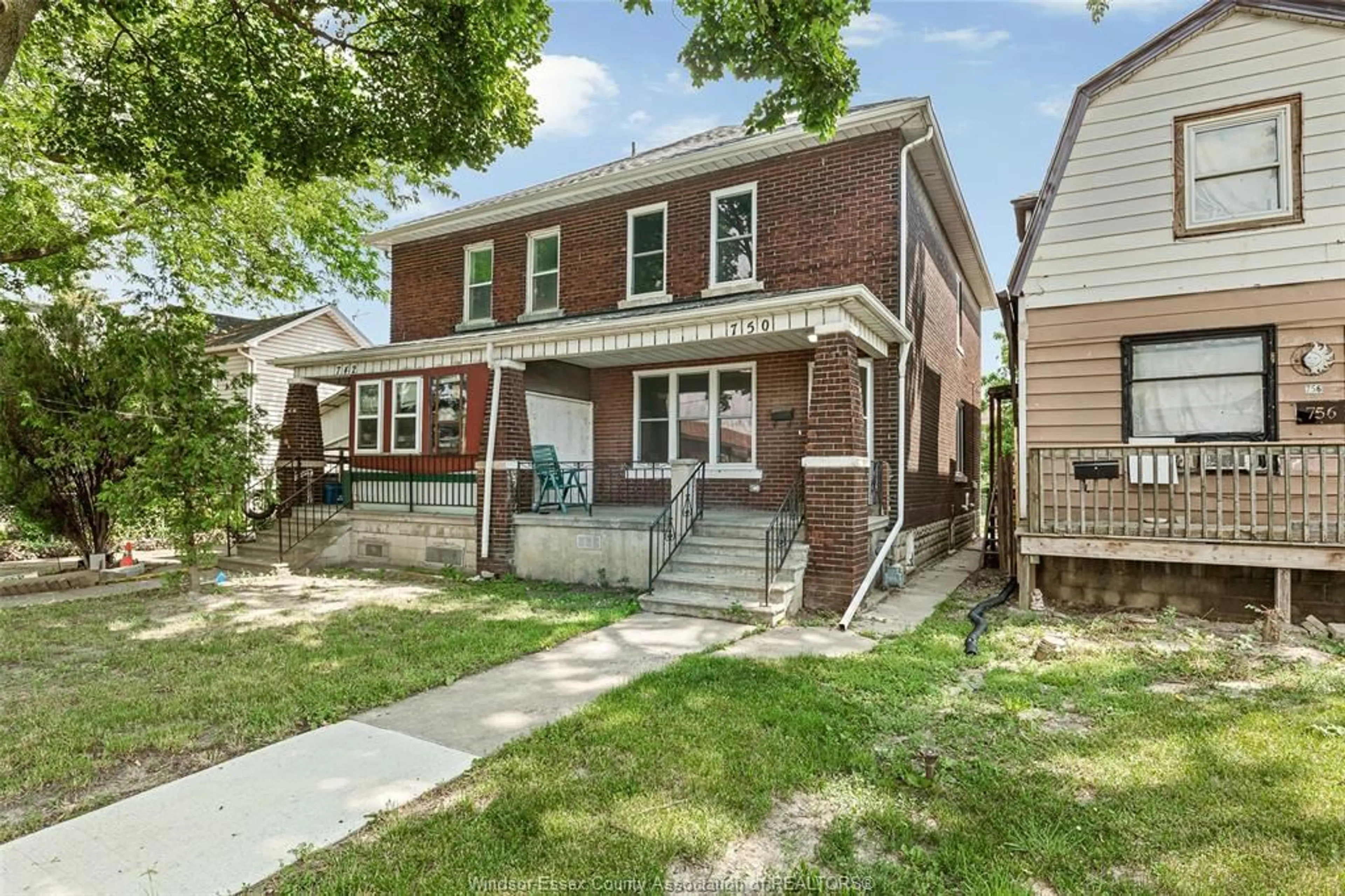 Home with brick exterior material, street for 750 CARON Ave, Windsor Ontario N9A 5B6