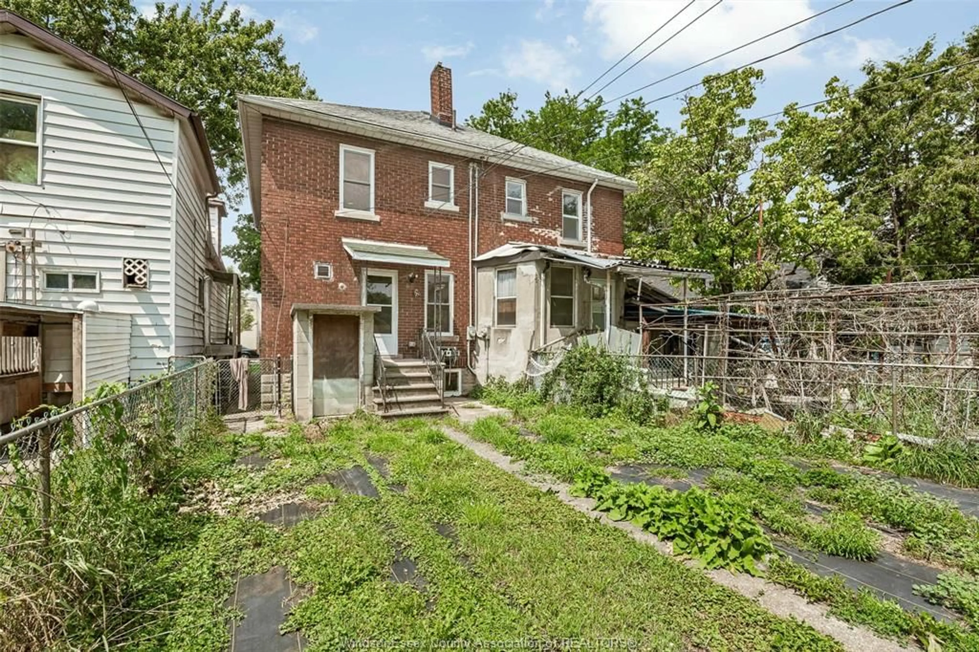 Home with brick exterior material, street for 750 CARON Ave, Windsor Ontario N9A 5B6