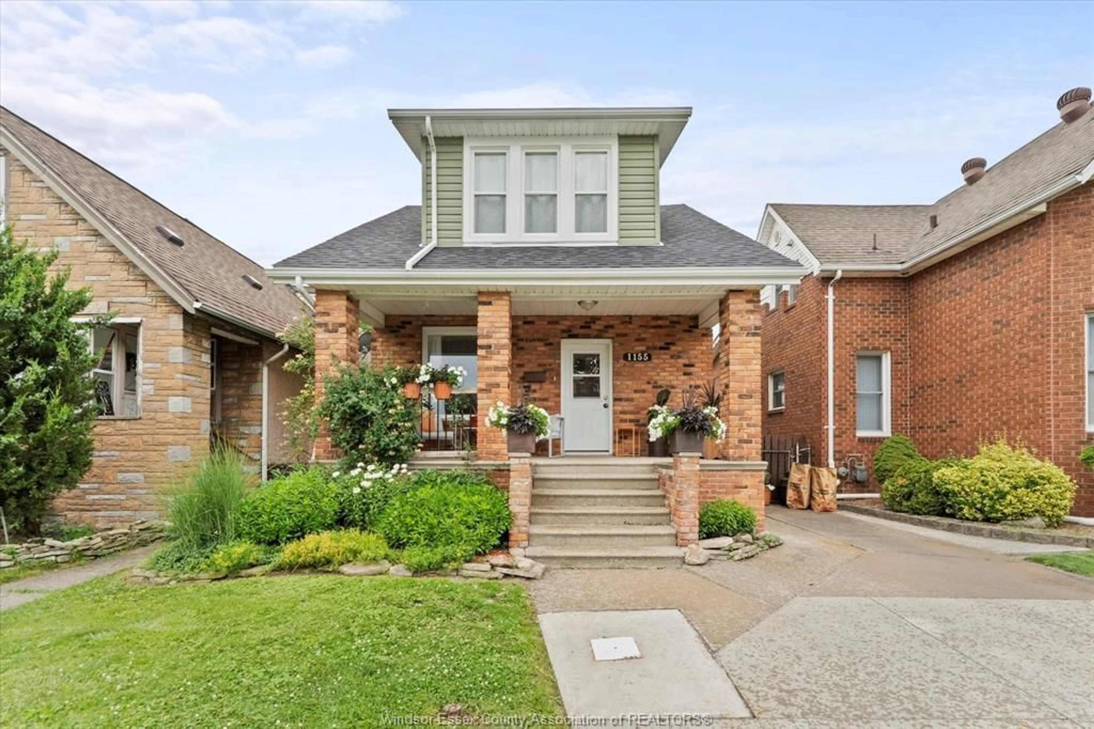 Home with brick exterior material, street for 1155 HALL, Windsor Ontario N9A 2M8