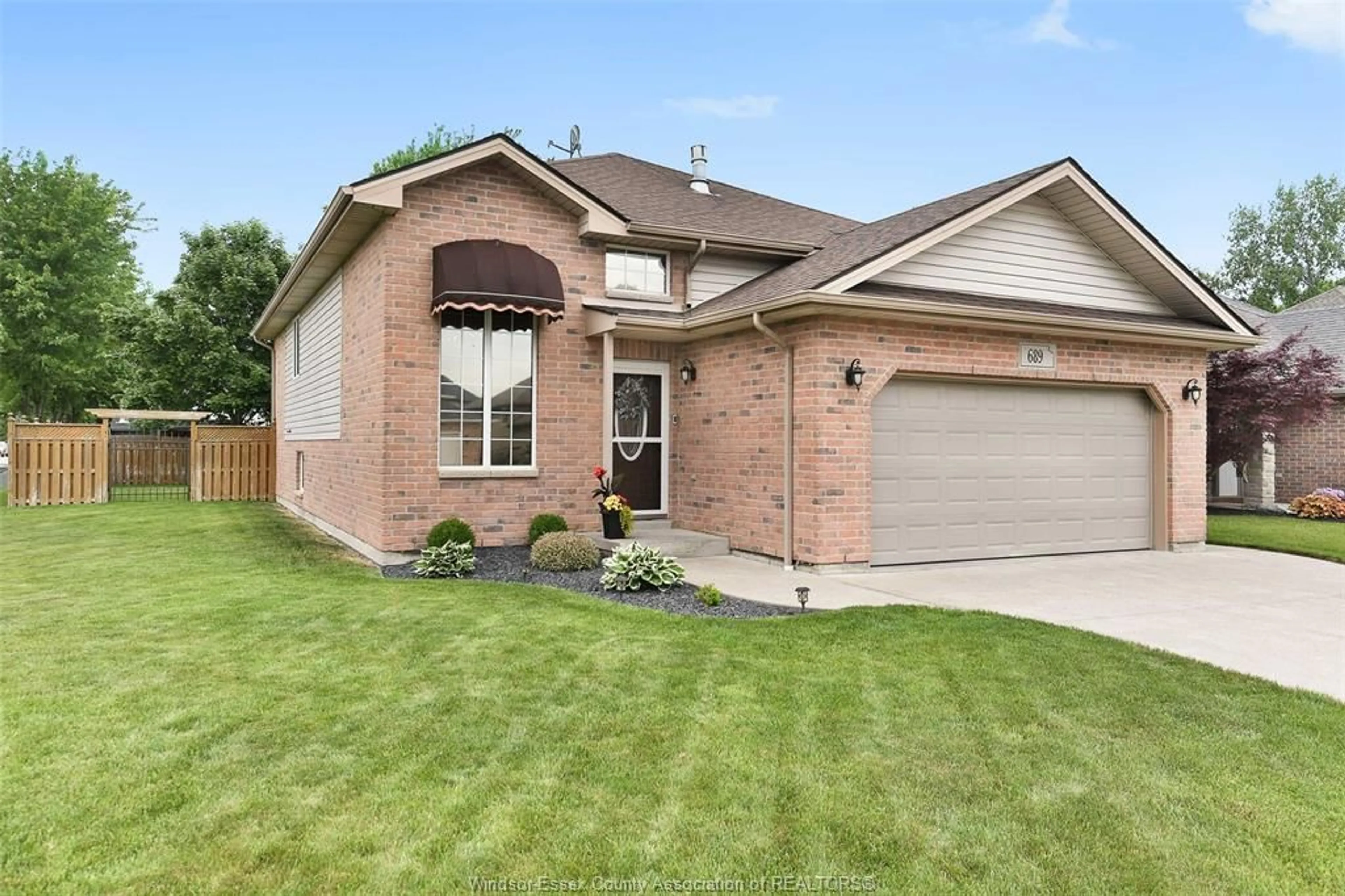 Home with brick exterior material, street for 689 Helena Cres, Belle River Ontario N0R 1A0