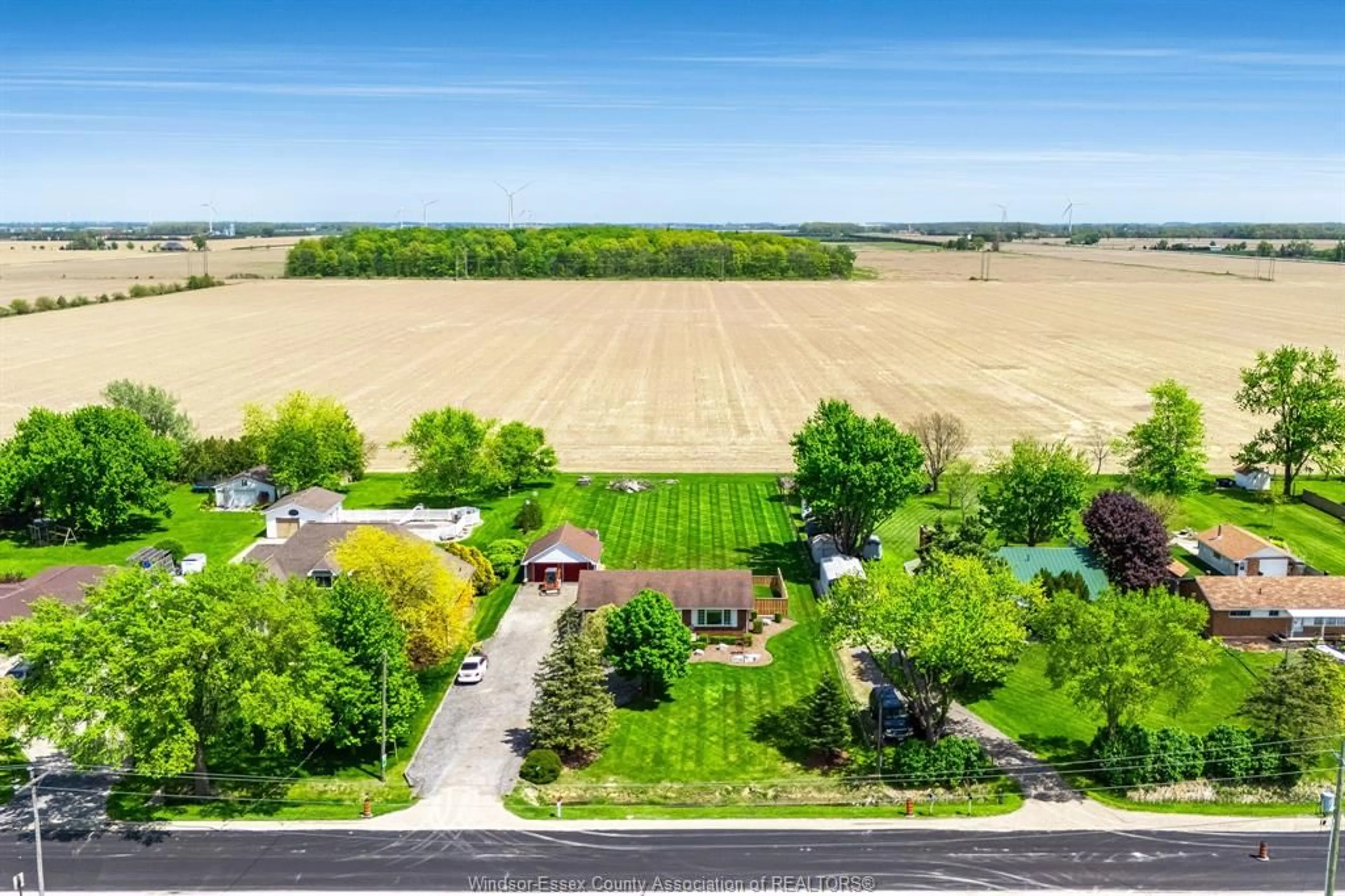 A pic from outside/outdoor area/front of a property/back of a property/a pic from drone, street for 2940 County Rd 27, Woodslee Ontario N0R 1V0