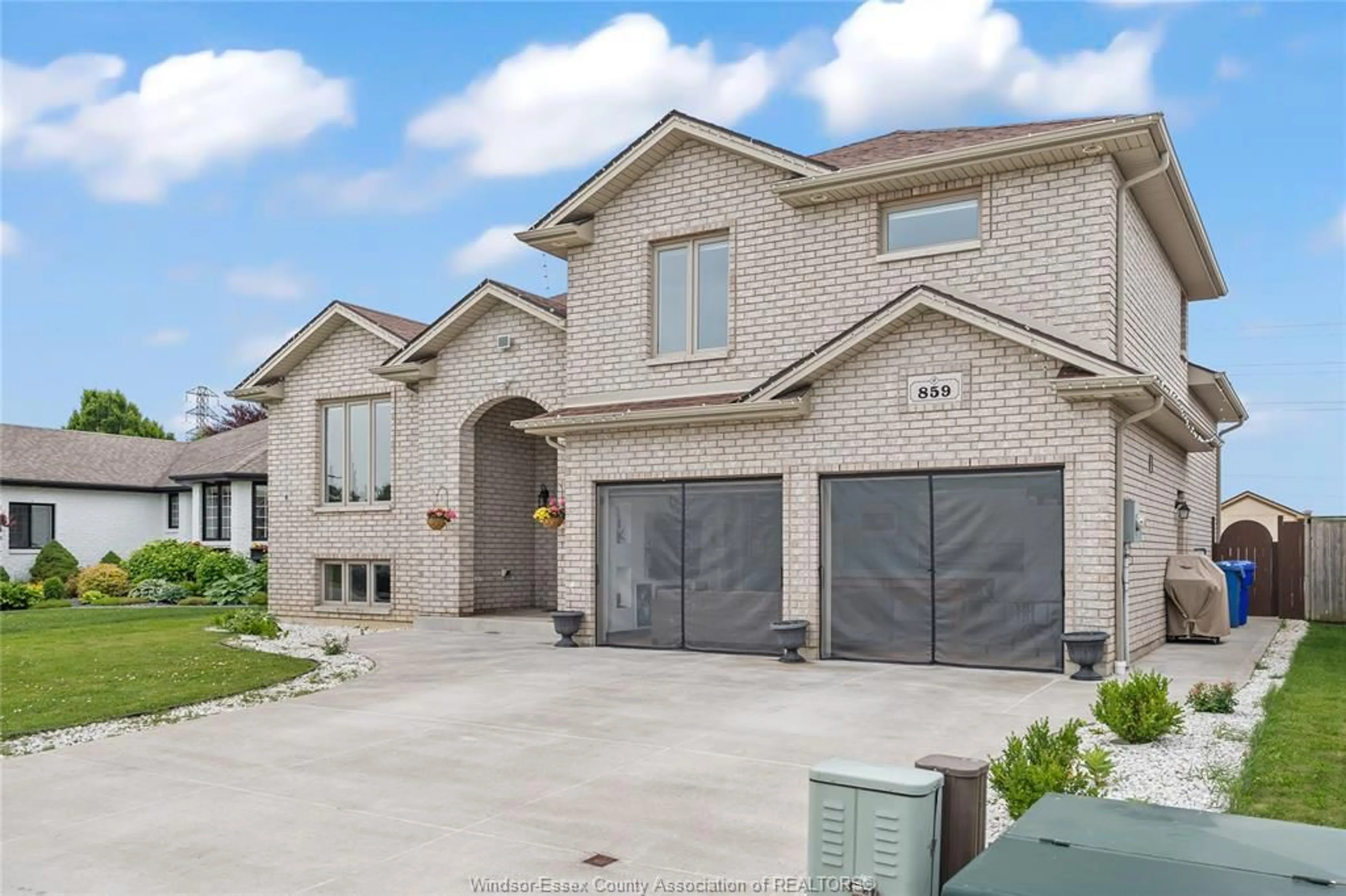 Home with brick exterior material, street for 859 SOUTHWOOD Dr, Lakeshore Ontario N0R 1A0