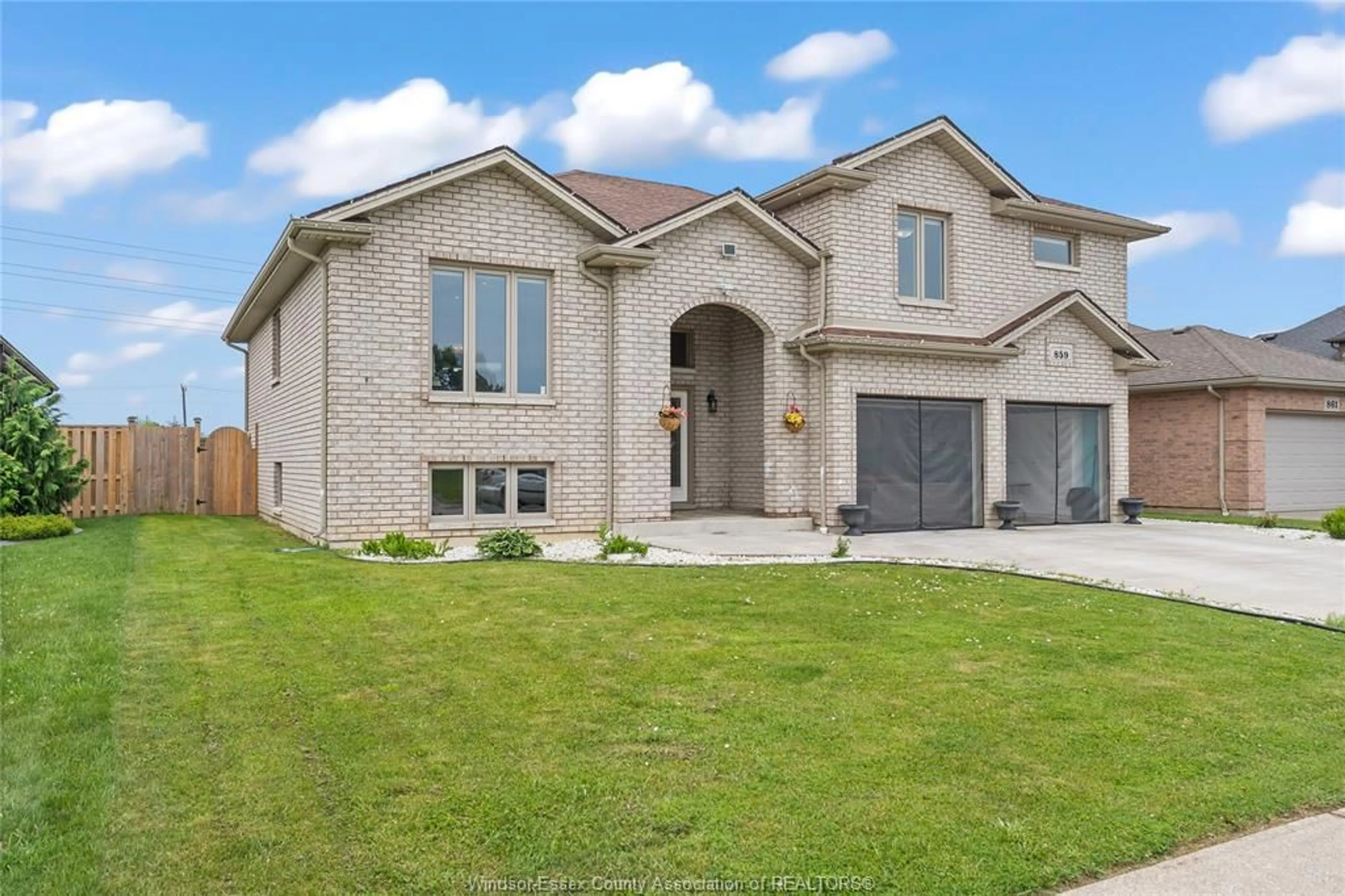 Home with brick exterior material, street for 859 SOUTHWOOD Dr, Lakeshore Ontario N0R 1A0