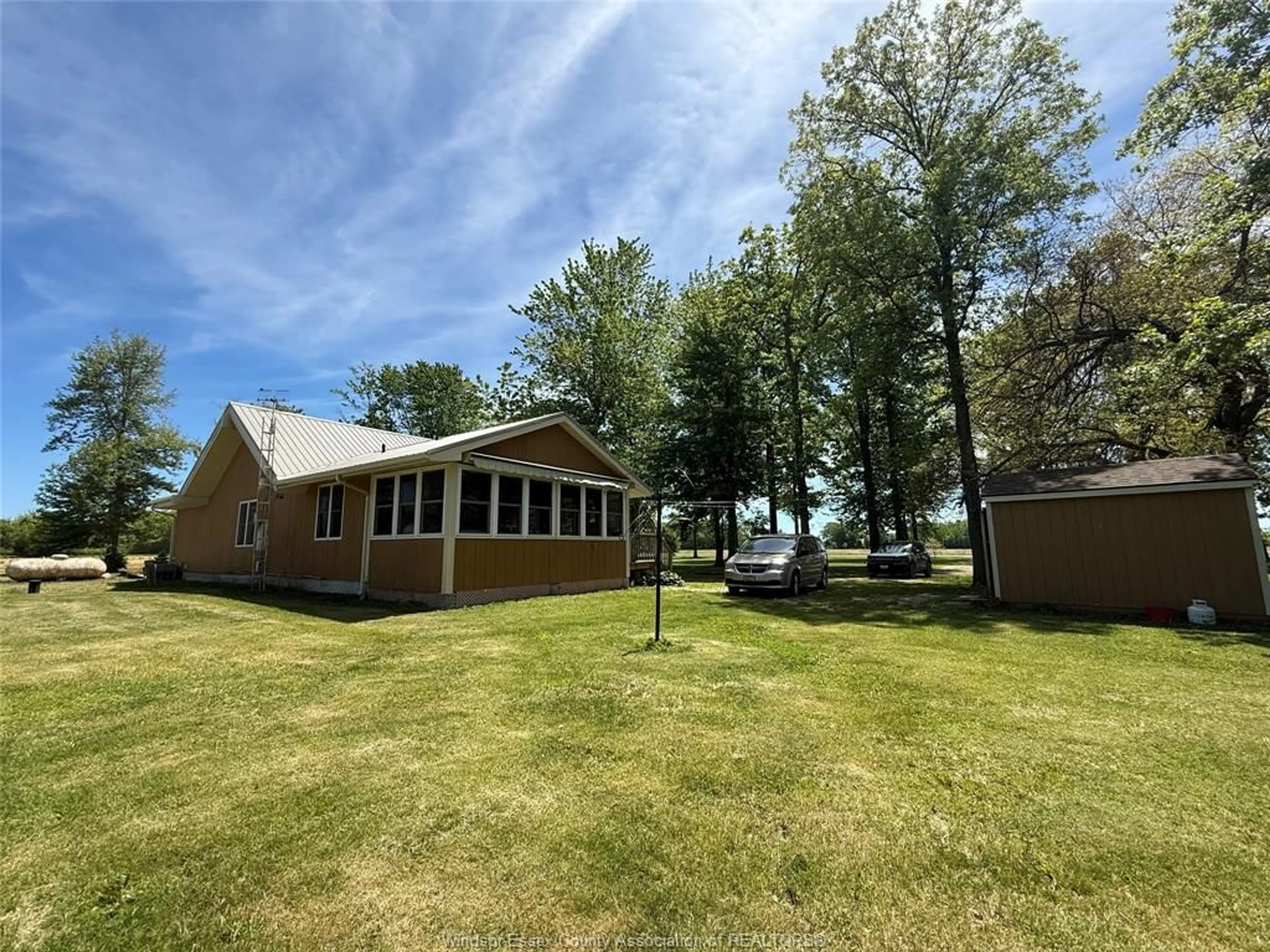 A pic from outside/outdoor area/front of a property/back of a property/a pic from drone, water/lake/river/ocean view for 543 East West Road Rd, Pelee Island Ontario N0R 1M0