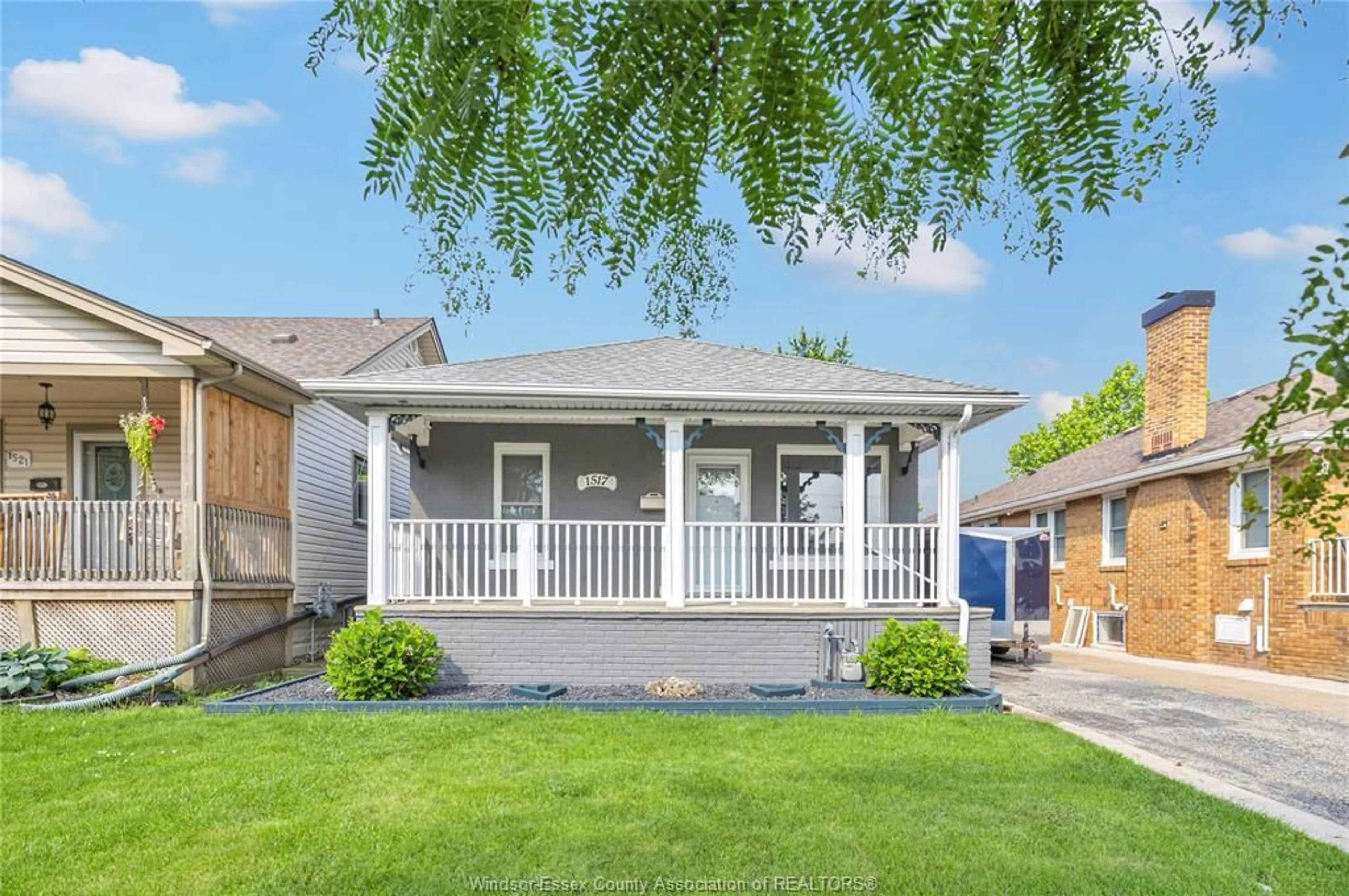 Home with vinyl exterior material, street for 1517 BERNARD Rd, Windsor Ontario N8Y 4K5