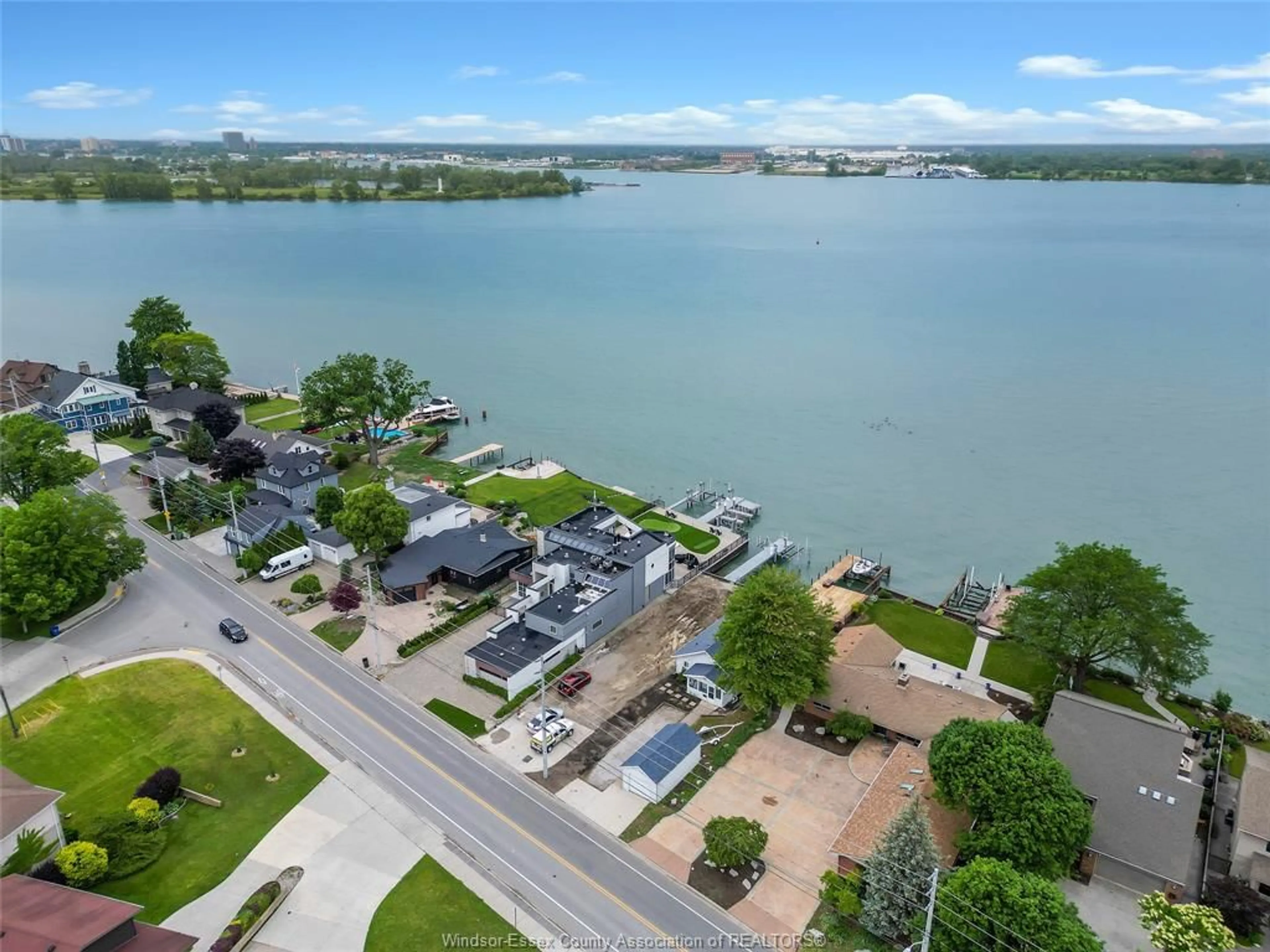 A pic from outside/outdoor area/front of a property/back of a property/a pic from drone, water/lake/river/ocean view for 8266 RIVERSIDE Dr, Windsor Ontario N8S 1E6