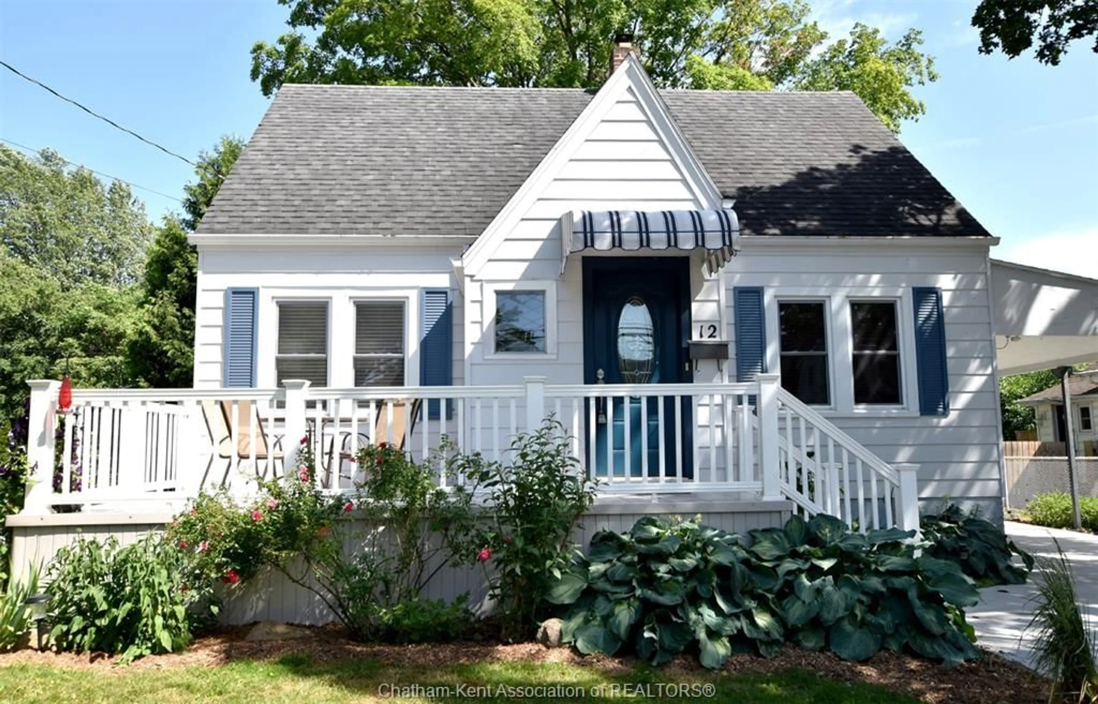 Home with vinyl exterior material, street for 12 Alexandra Ave, Chatham Ontario N7M 1Y1