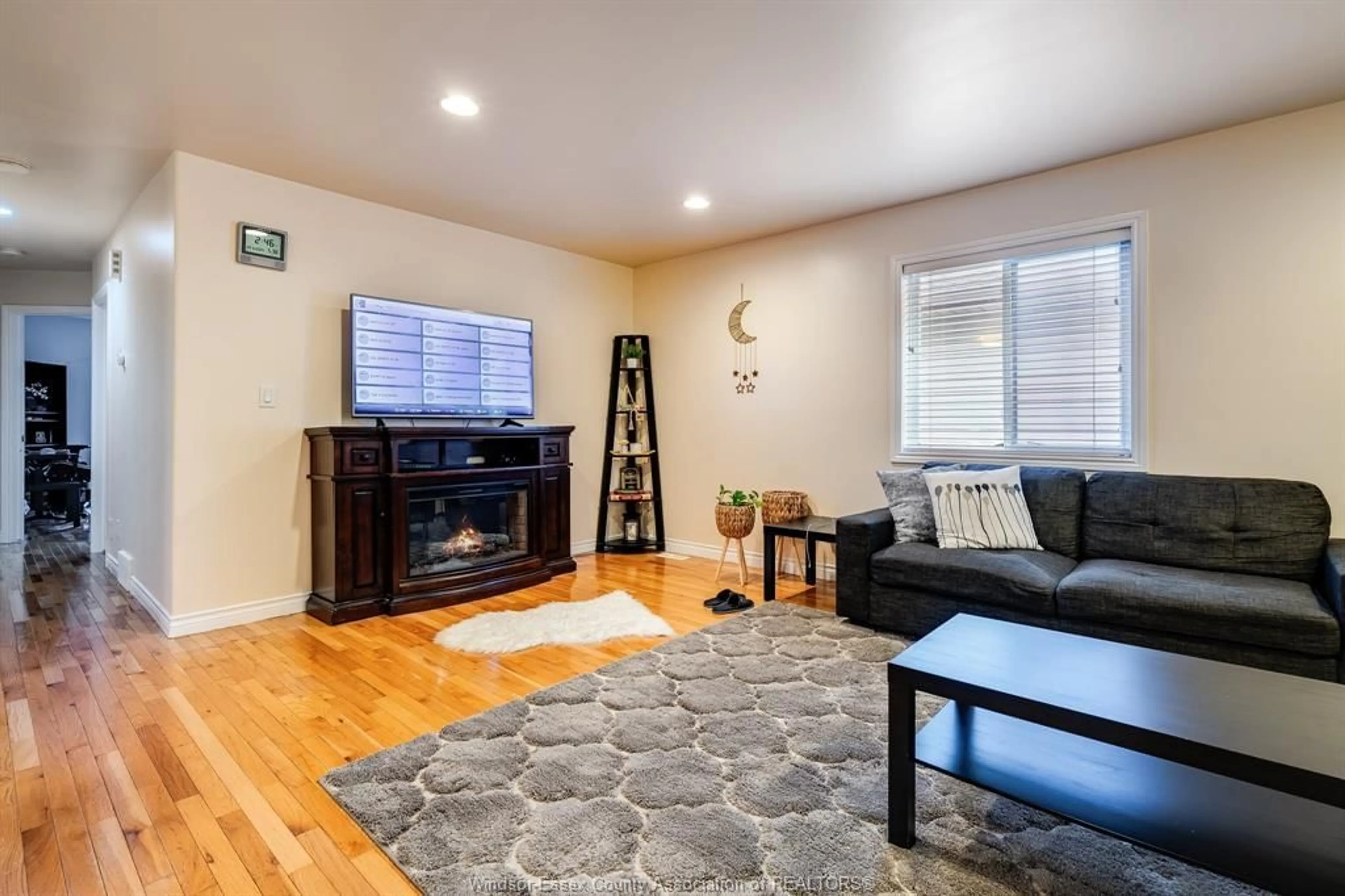 Living room with furniture, wood/laminate floor for 4244 Showdown Ave, Windsor Ontario N9G 3B1