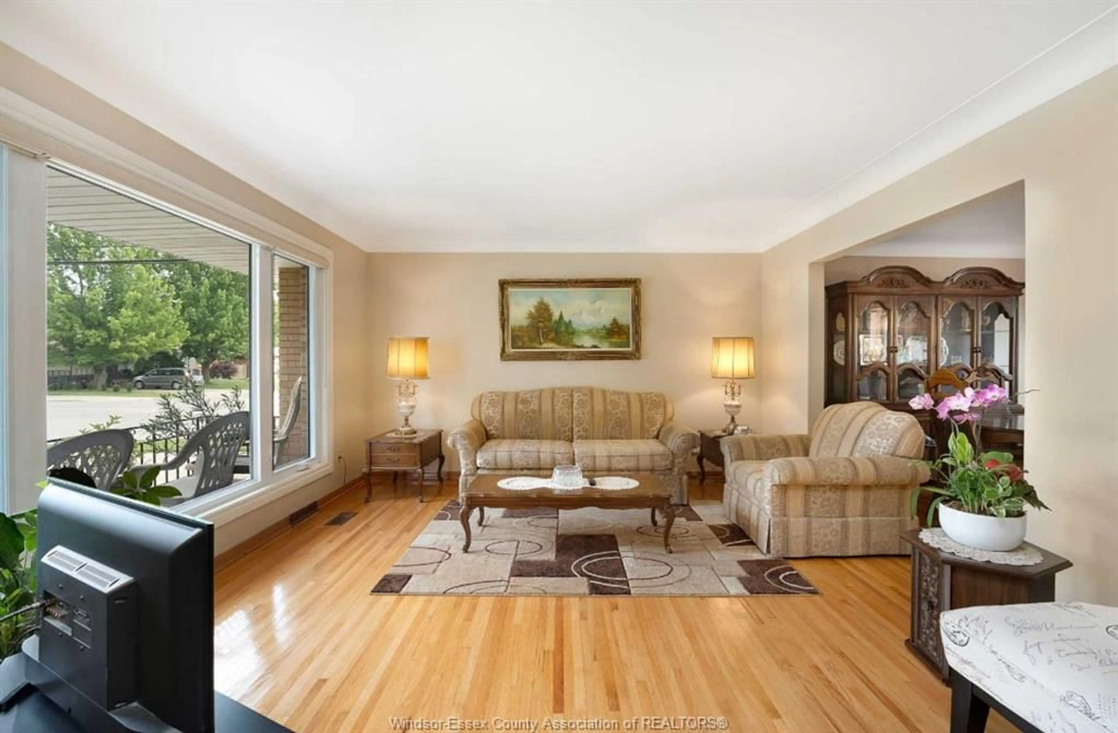 Living room with furniture, wood/laminate floor for 2395 EVERTS, Windsor Ontario N9E 3Y1