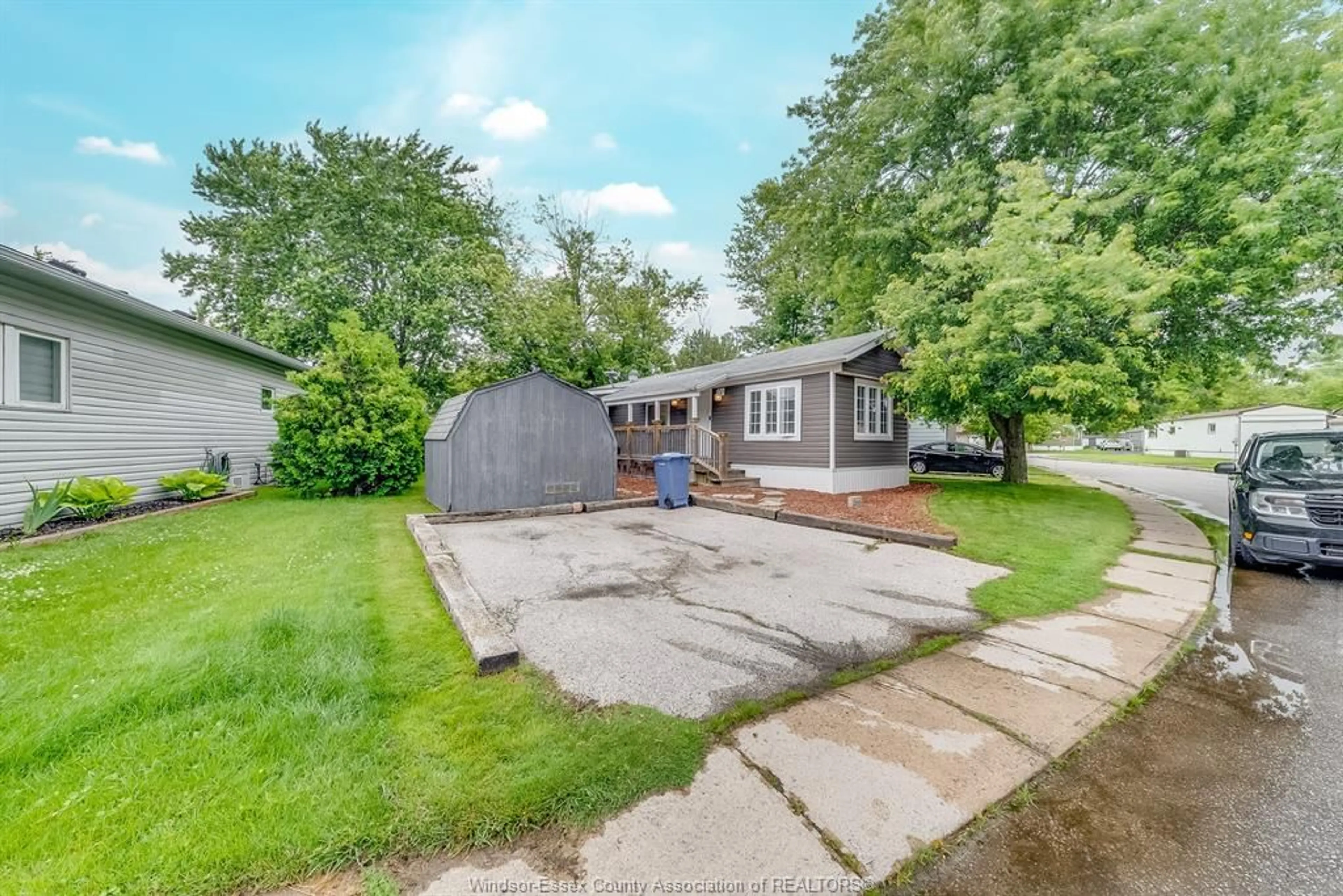 A pic from outside/outdoor area/front of a property/back of a property/a pic from drone, street for 200 STEVEN Crt, Essex Ontario N8M 2A8