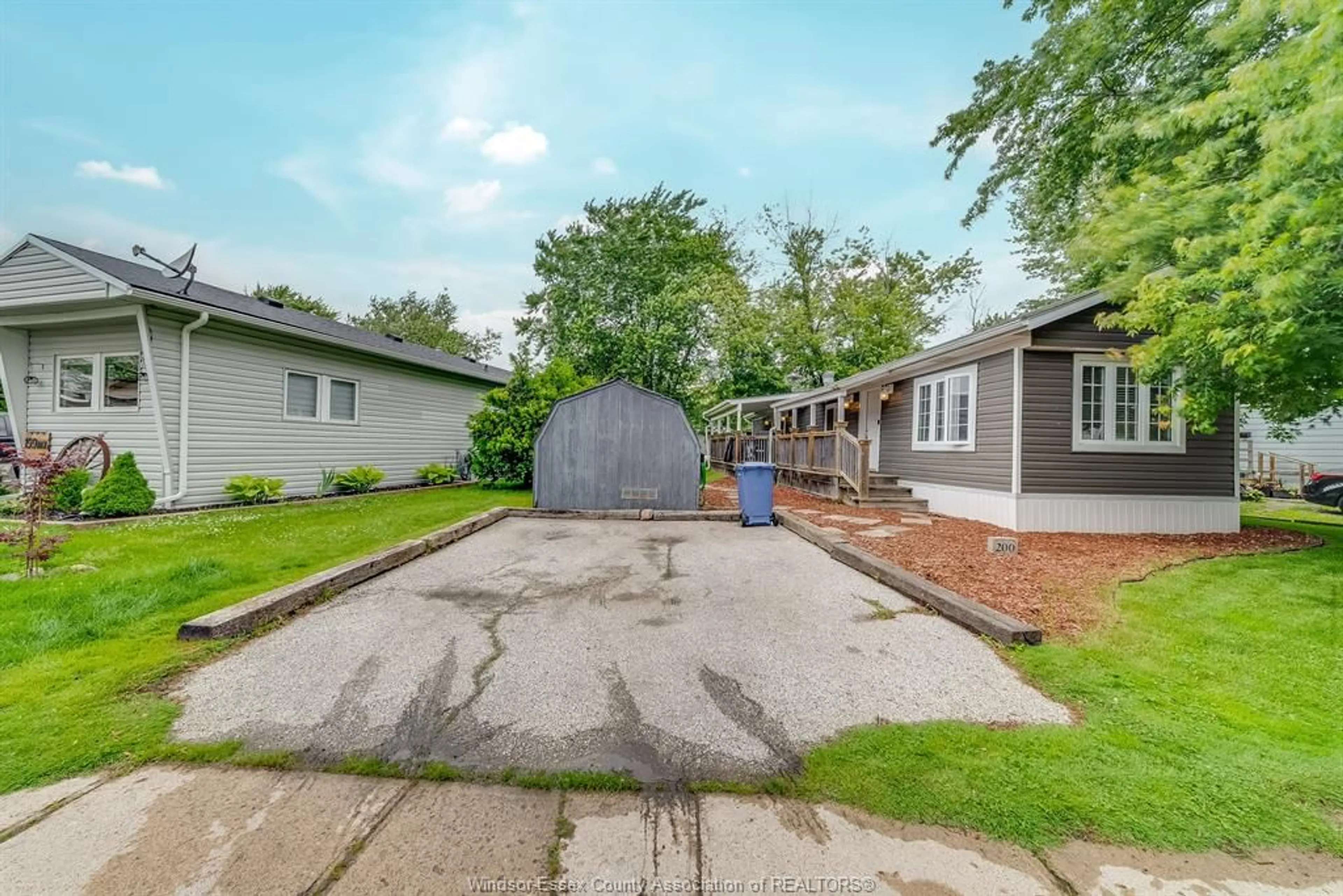 A pic from outside/outdoor area/front of a property/back of a property/a pic from drone, street for 200 STEVEN Crt, Essex Ontario N8M 2A8