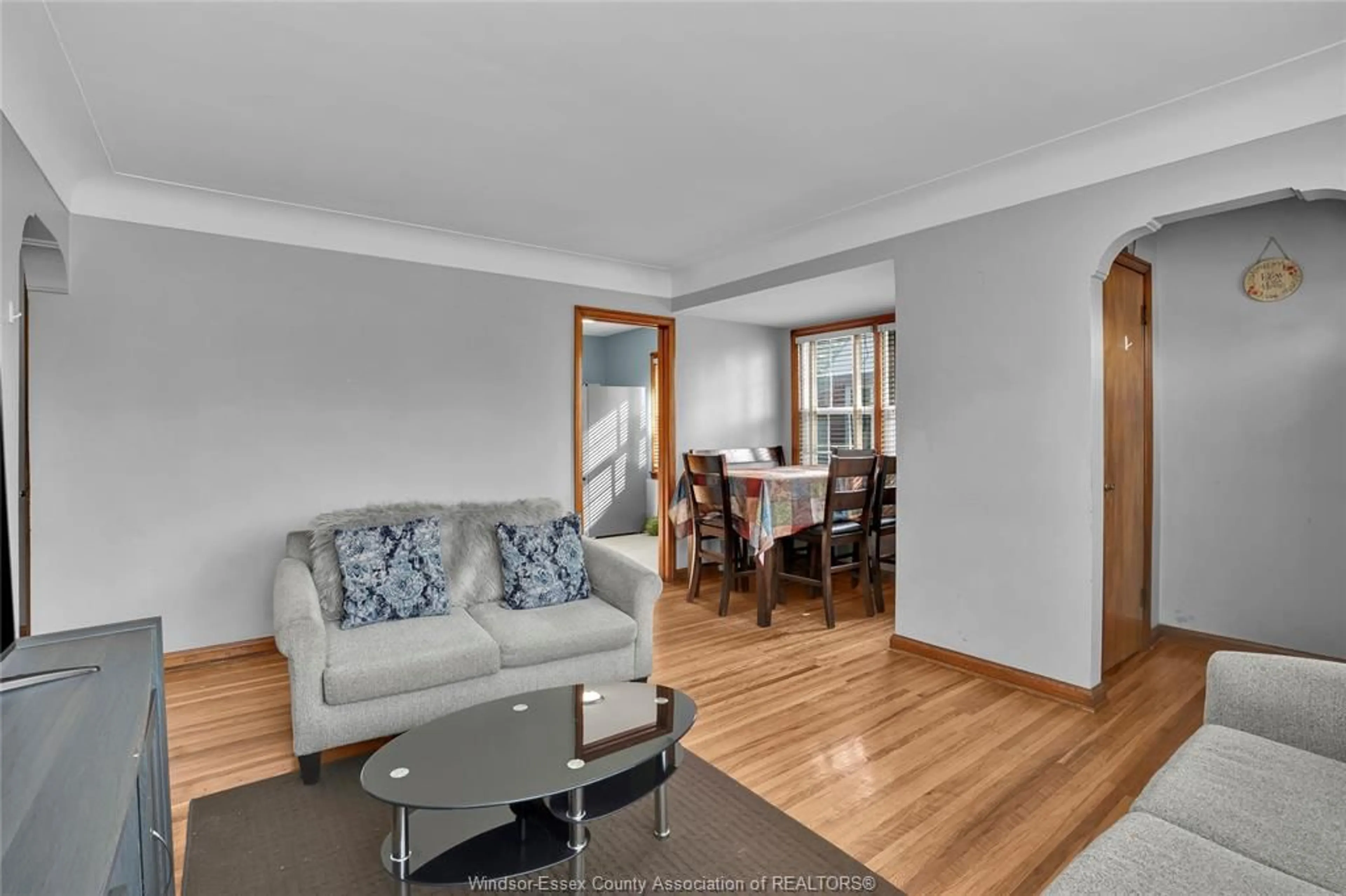 Living room with furniture, wood/laminate floor for 824 YPRES Ave, Windsor Ontario N8W 1P8