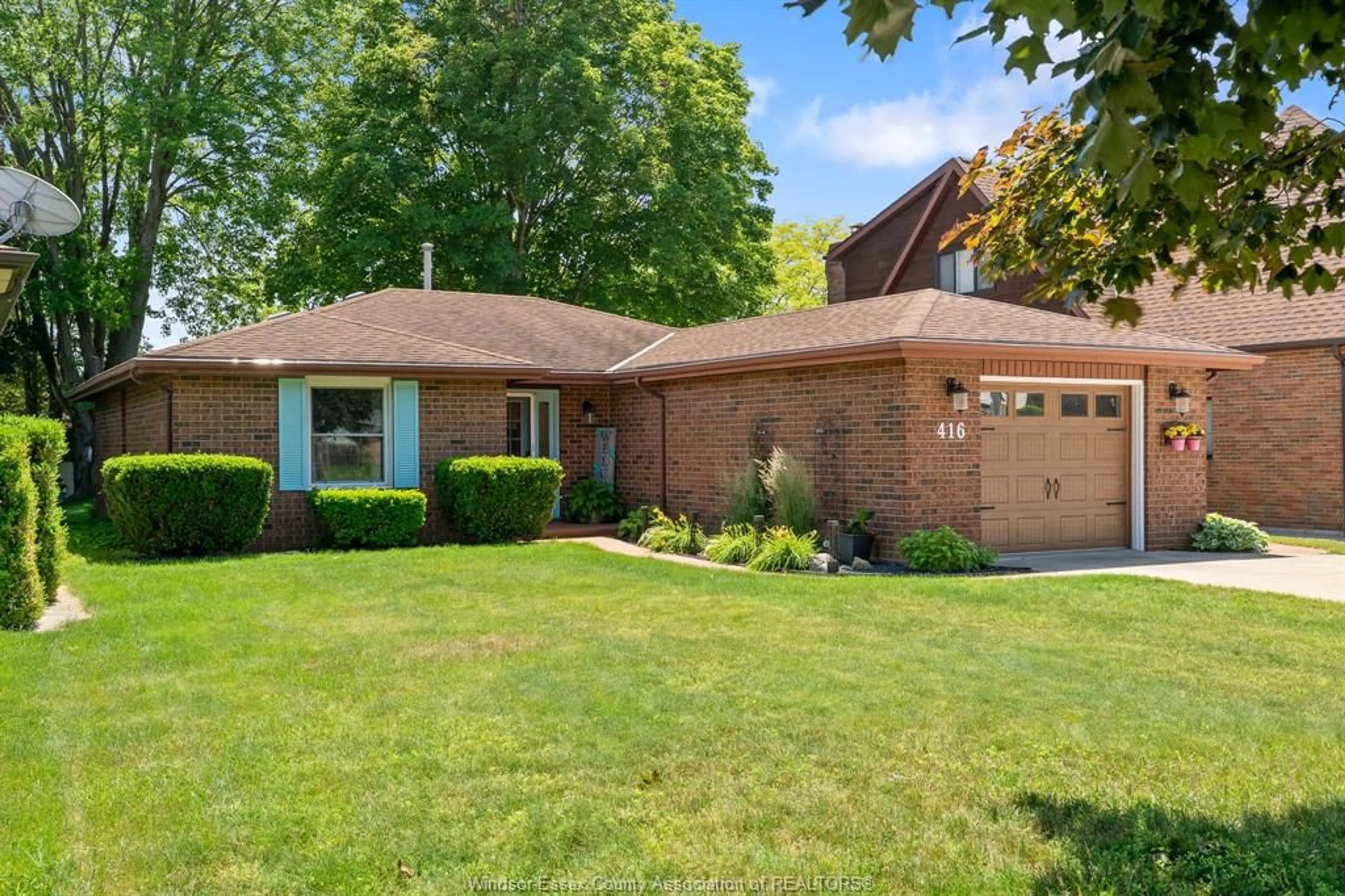 Home with brick exterior material, street for 416 Oak St, Leamington Ontario N8H 3V7