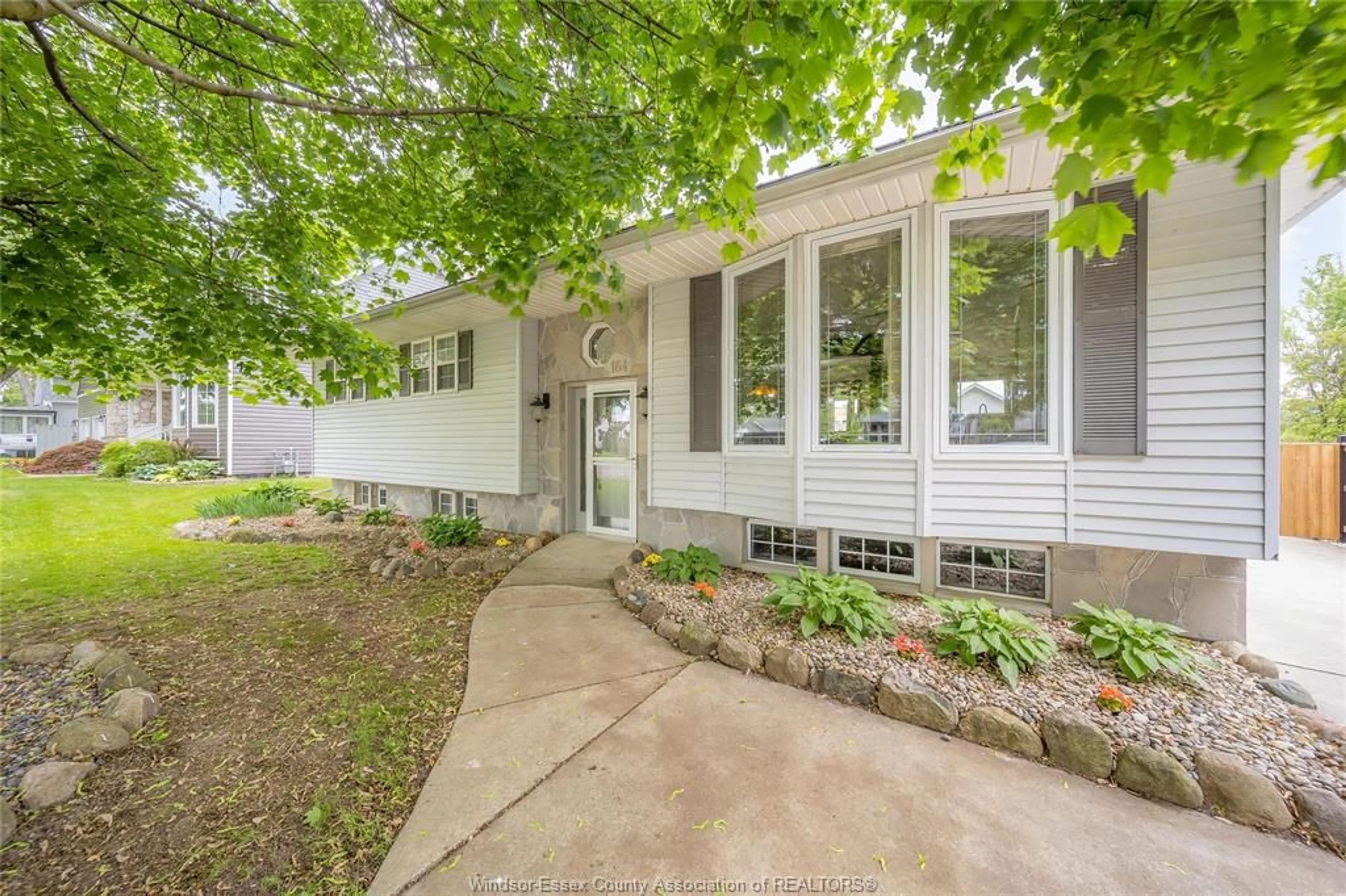 Home with vinyl exterior material, street for 164 MUNGER Ave, Harrow Ontario N0R 1G0
