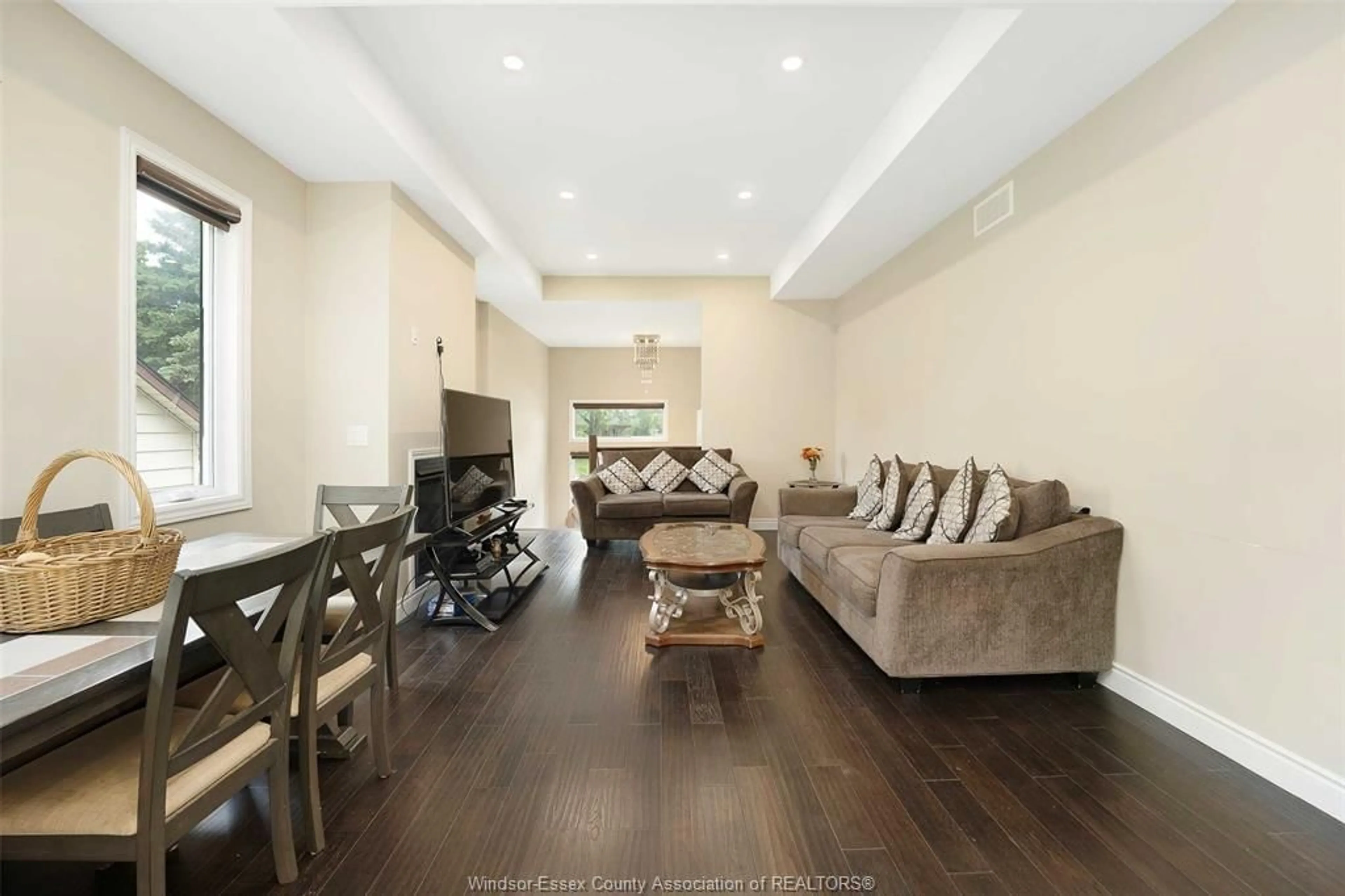 Living room with furniture, wood/laminate floor for 522 LESPERANCE ROAD, Tecumseh Ontario N8N 1W4