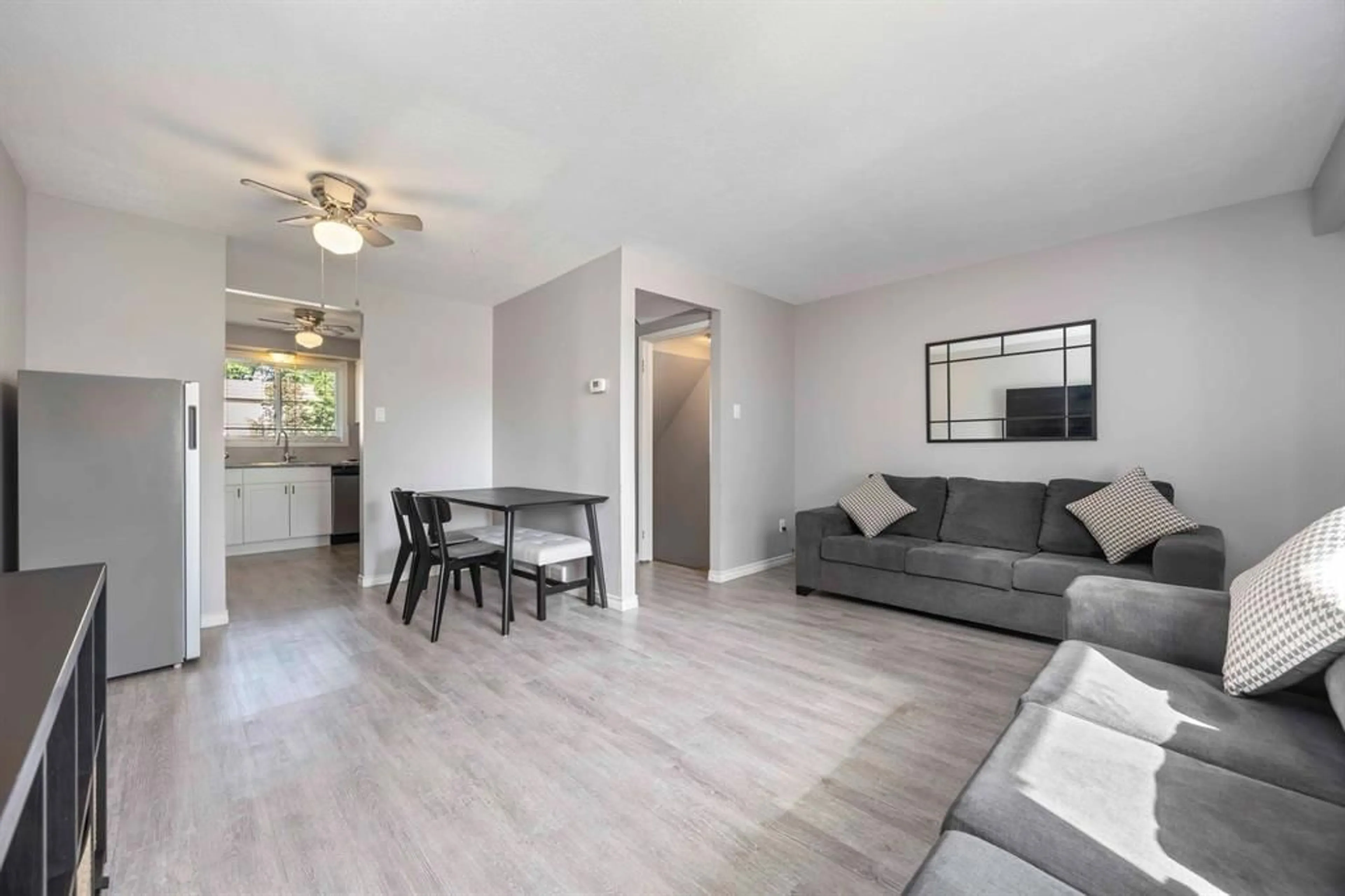 Living room with furniture, wood/laminate floor for 27 TURNER Dr, Sarnia Ontario N7S 4R9
