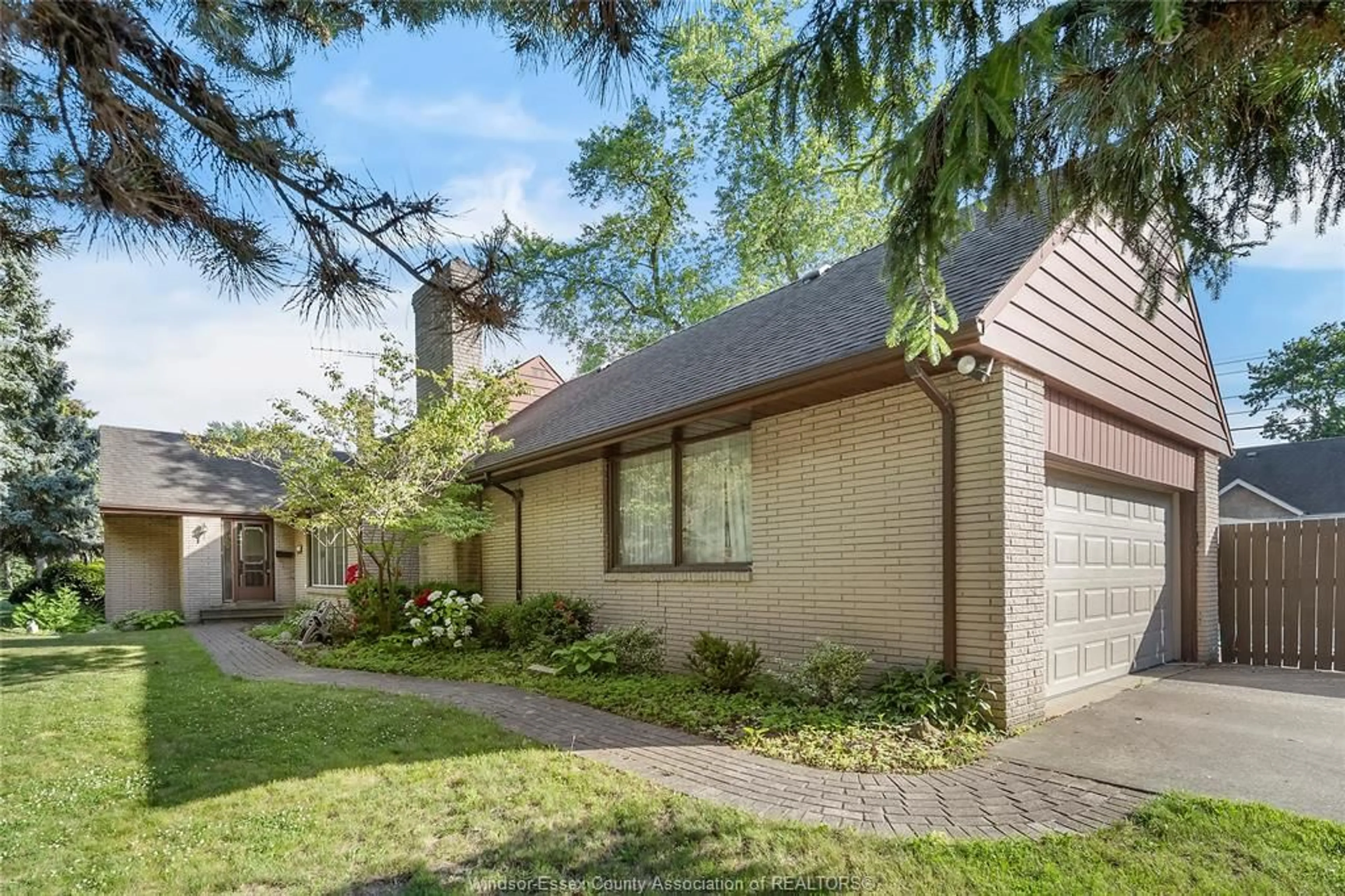 Home with brick exterior material, street for 4015 DOUGALL AVENUE, Windsor Ontario N9G 1X4