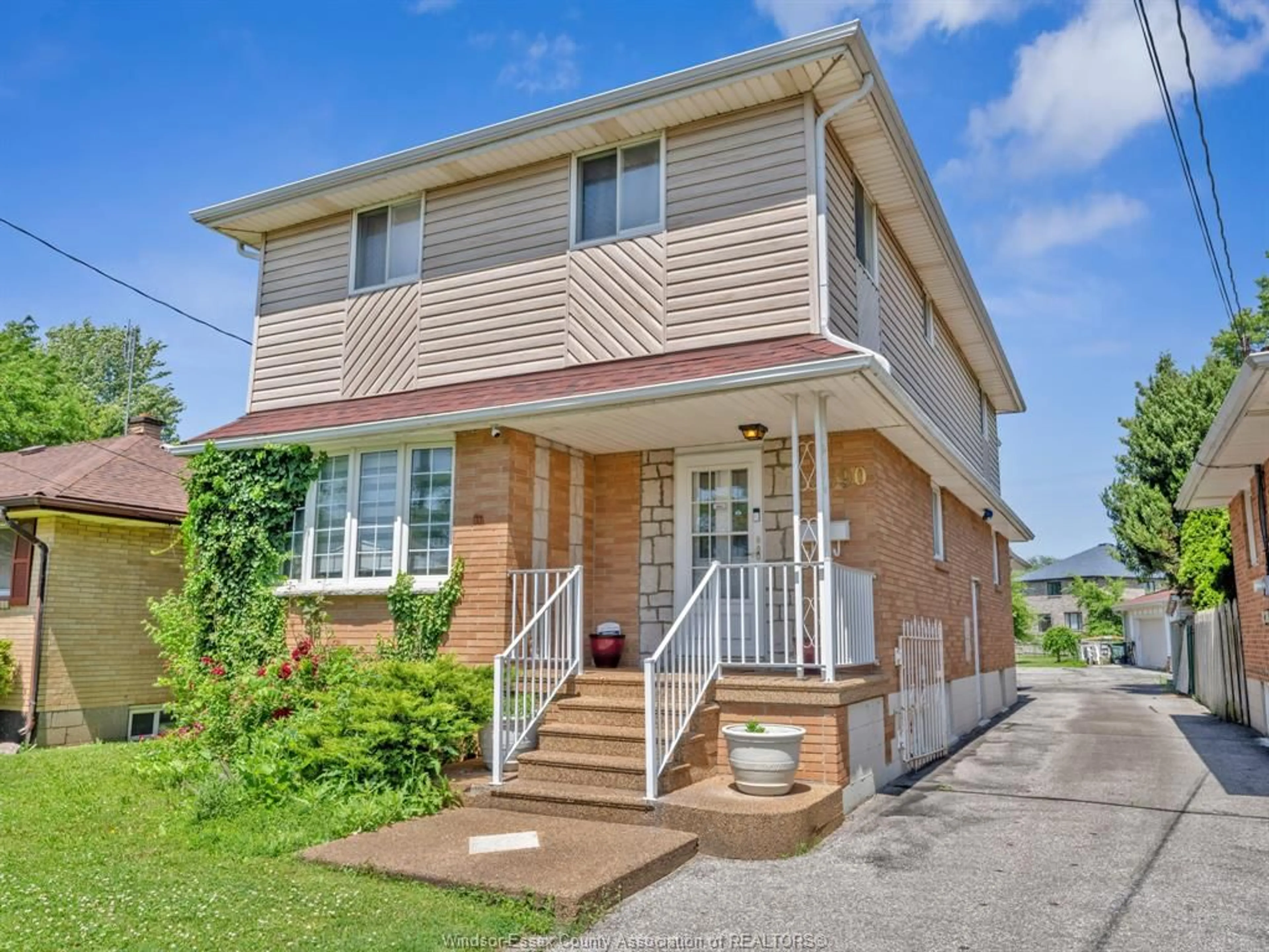 Home with brick exterior material, street for 2690 TOURANGEAU Rd, Windsor Ontario N8W 4P3
