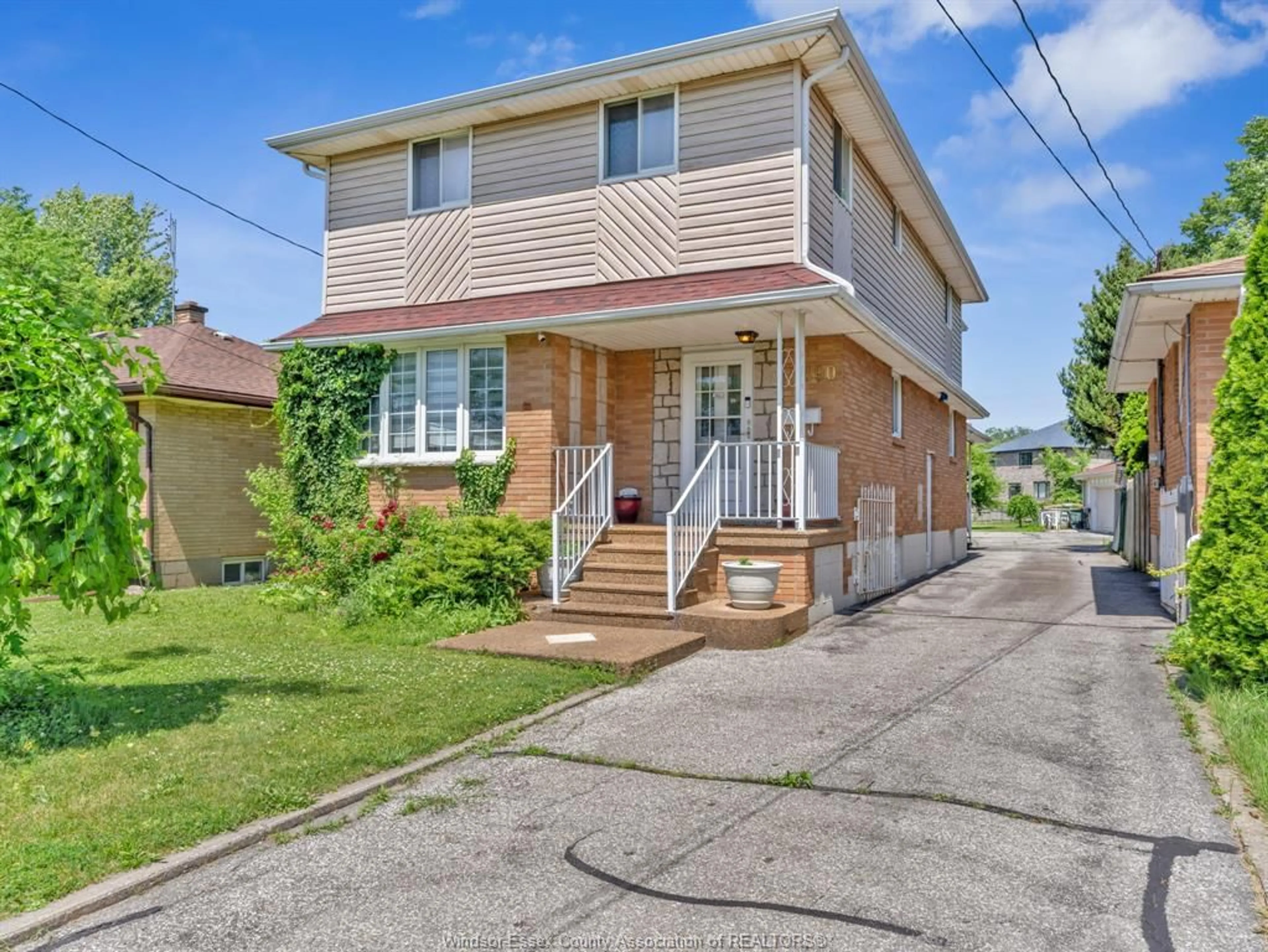 Home with brick exterior material, street for 2690 TOURANGEAU Rd, Windsor Ontario N8W 4P3