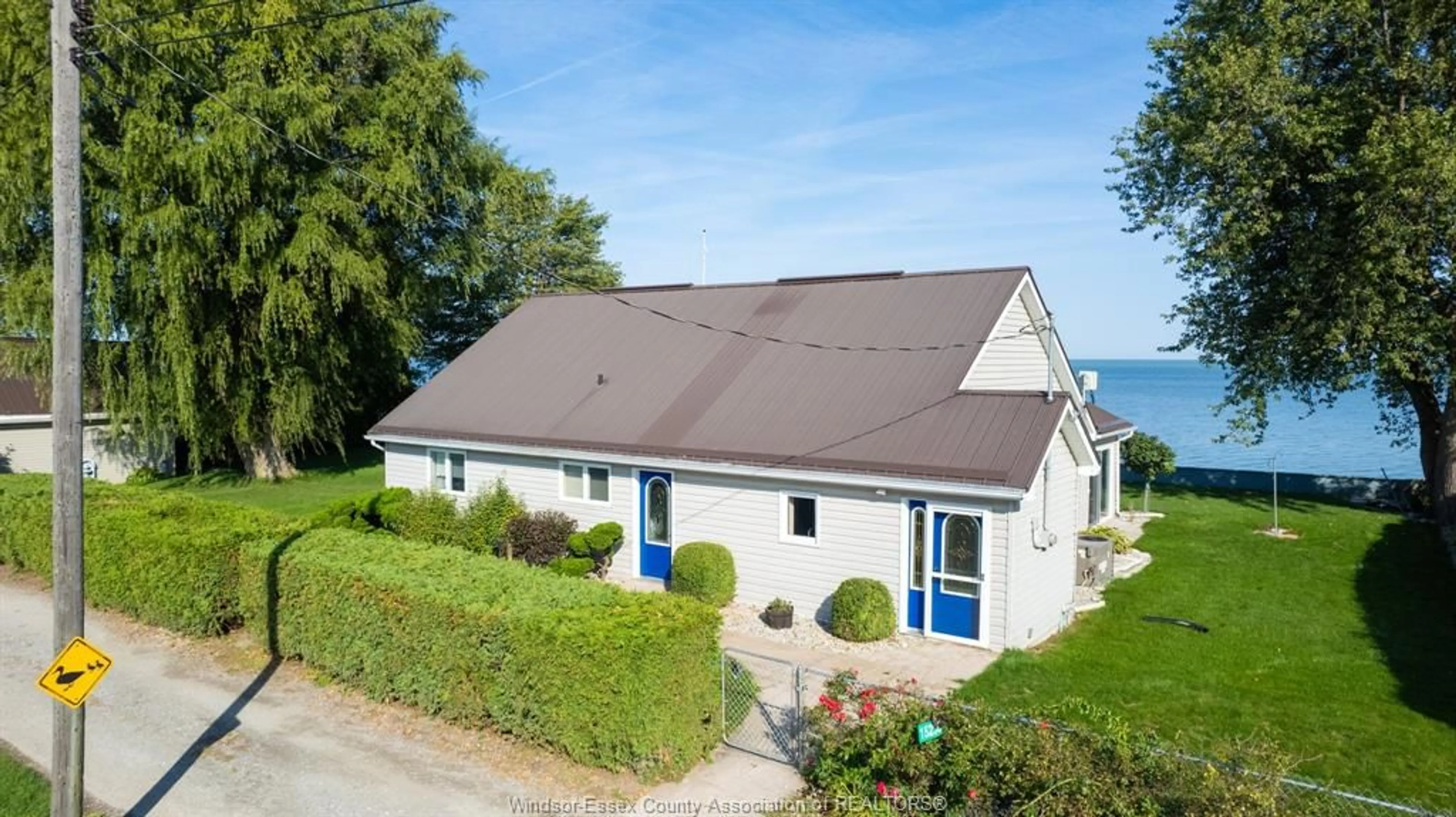A pic from outside/outdoor area/front of a property/back of a property/a pic from drone, street for 15230 COUTURE BEACH, Lakeshore Ontario N0P 2L0