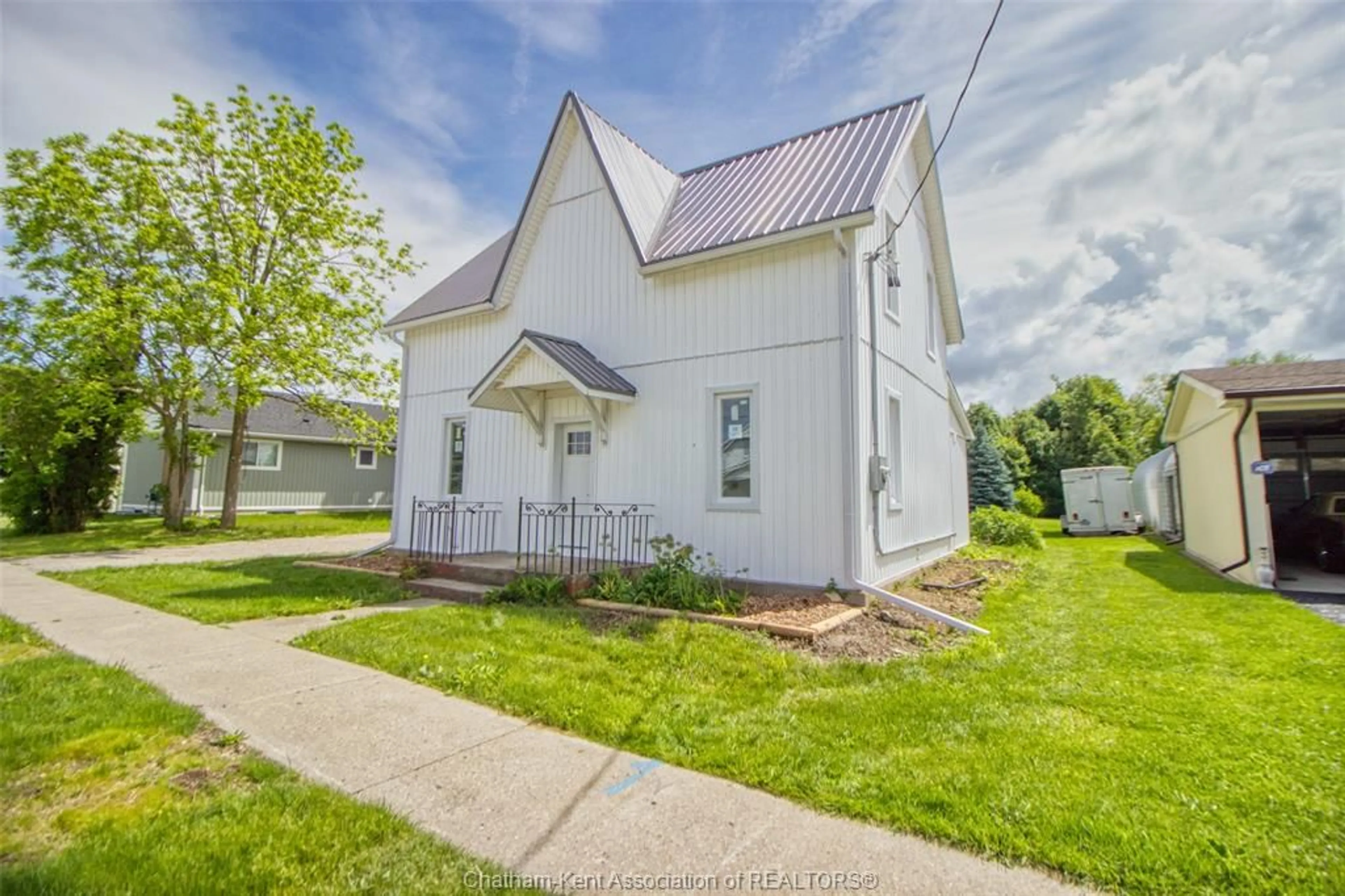 Home with vinyl exterior material, street for 56 King St, Lambton Shores Ontario N0M 2N0