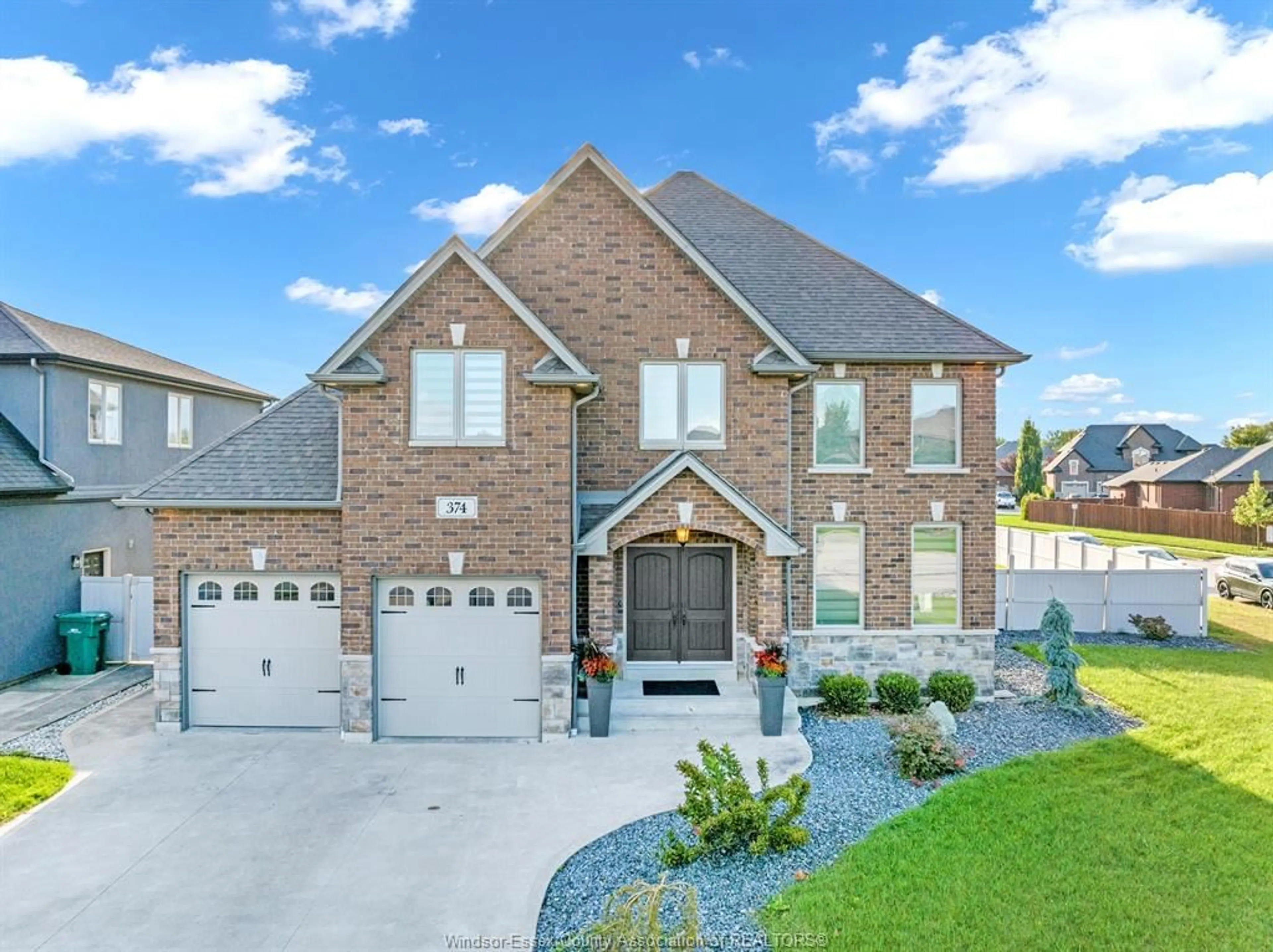Home with brick exterior material, street for 374 POPLAR DRIVE, Lakeshore Ontario N8L 0X4
