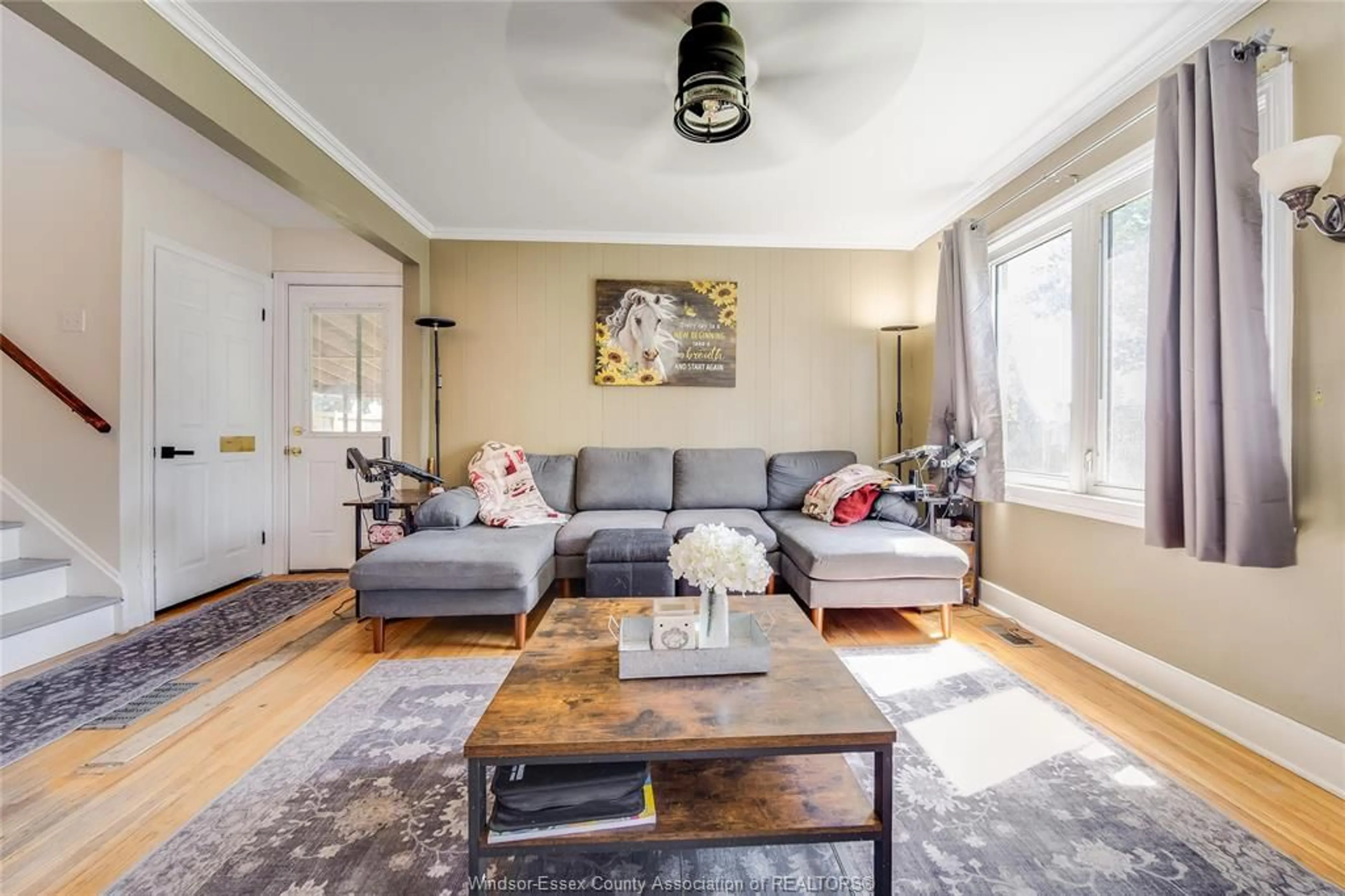 Living room with furniture, wood/laminate floor for 2102 SECORD, Windsor Ontario N9B 1T2