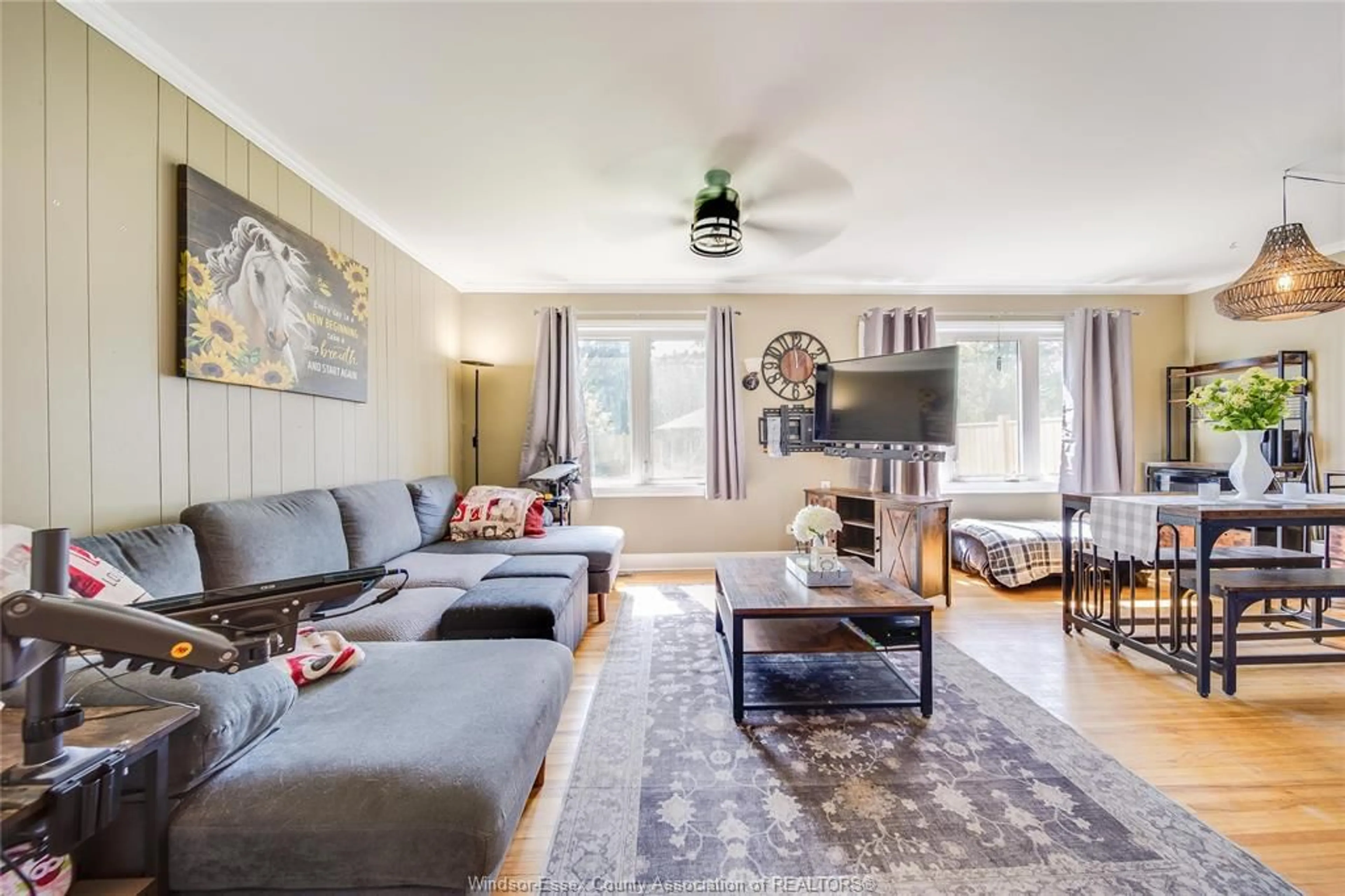 Living room with furniture, wood/laminate floor for 2102 SECORD, Windsor Ontario N9B 1T2