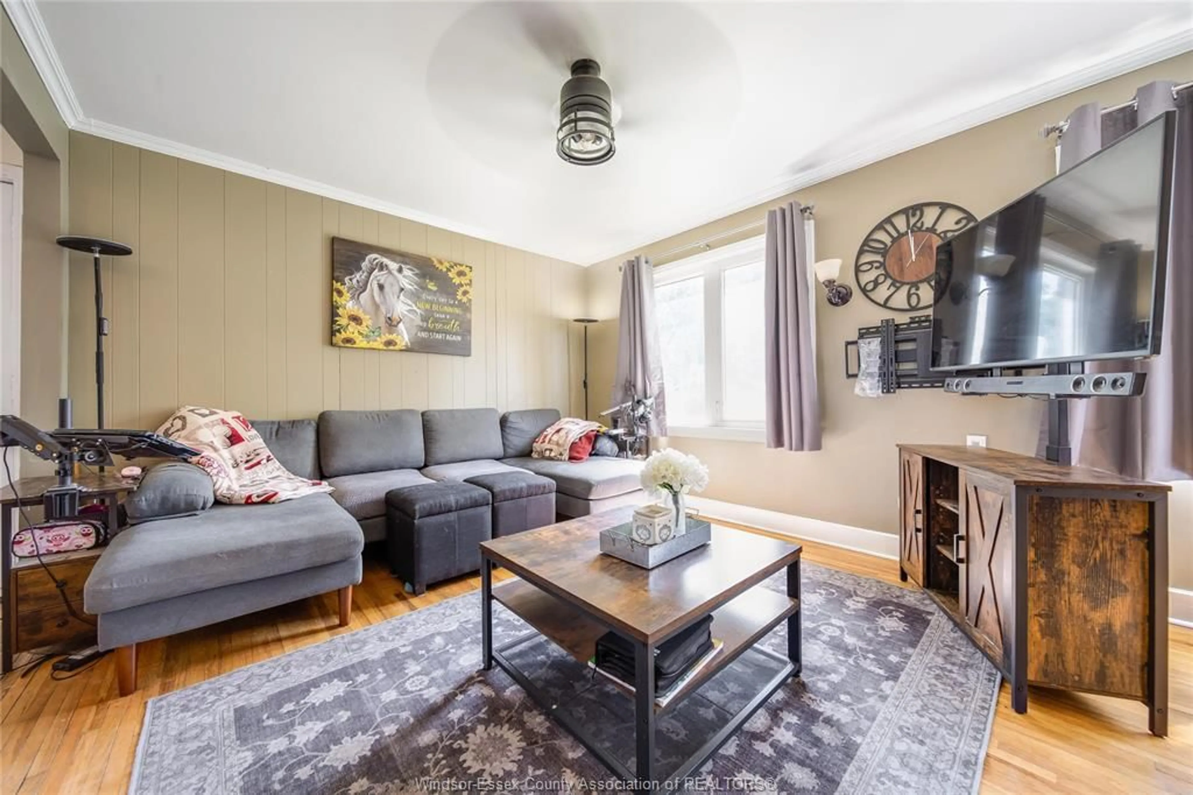 Living room with furniture, wood/laminate floor for 2102 SECORD, Windsor Ontario N9B 1T2