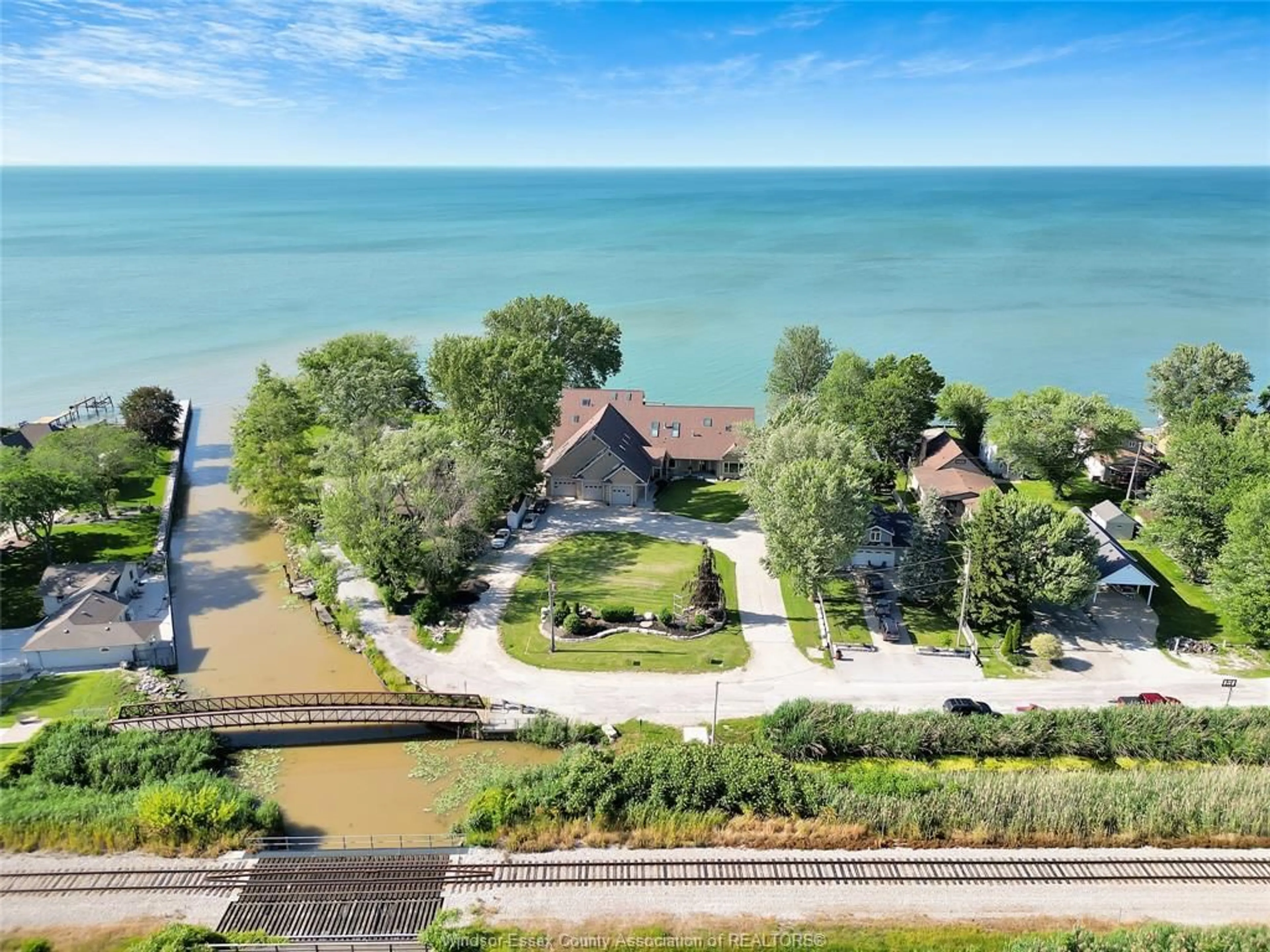 A pic from outside/outdoor area/front of a property/back of a property/a pic from drone, water/lake/river/ocean view for 331 CHARRON BEACH, Belle River Ontario N0R 1A0