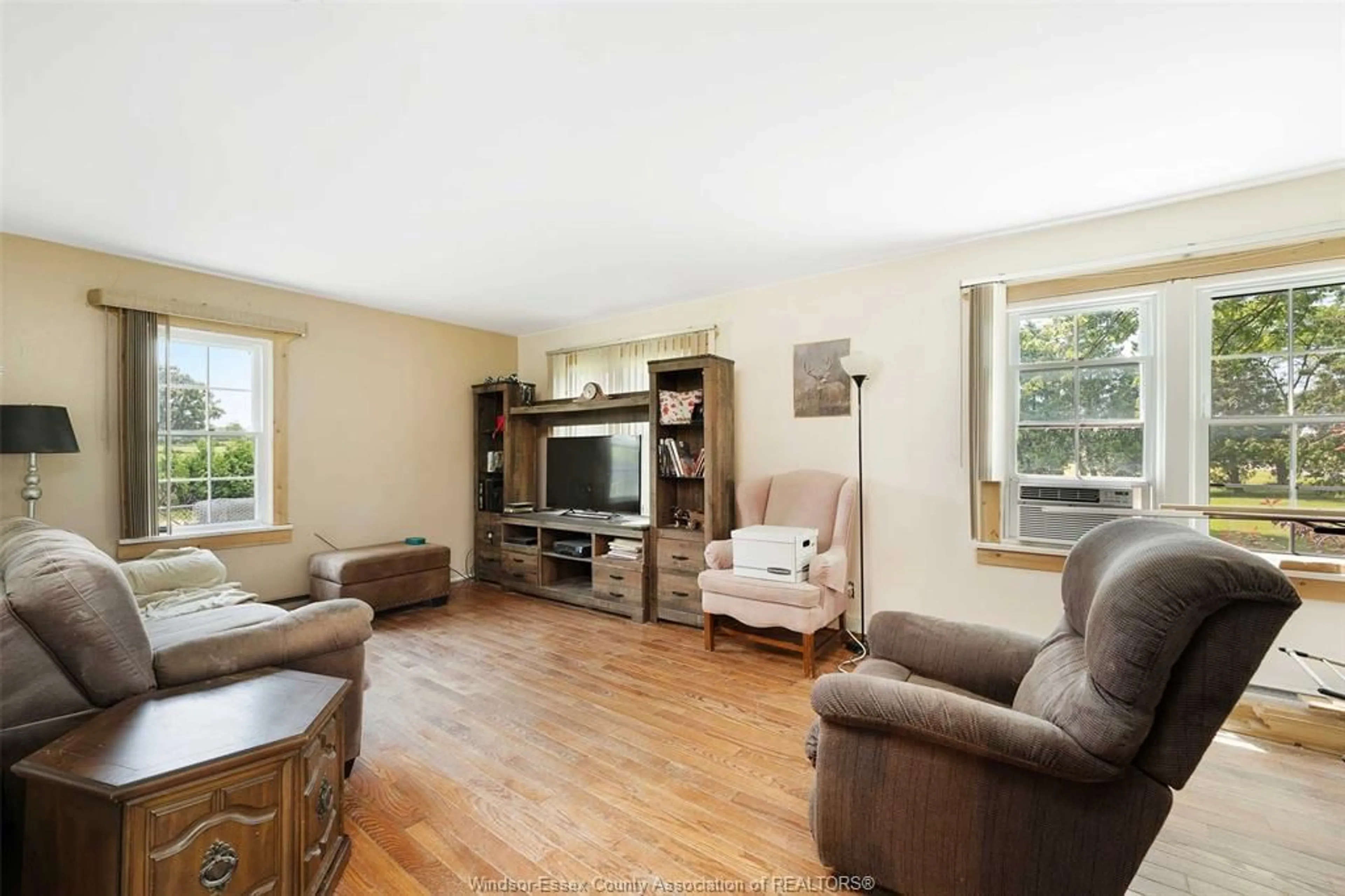 Living room with furniture, wood/laminate floor for 344 S MIDDLE Rd, Lakeshore Ontario N0R 1K0