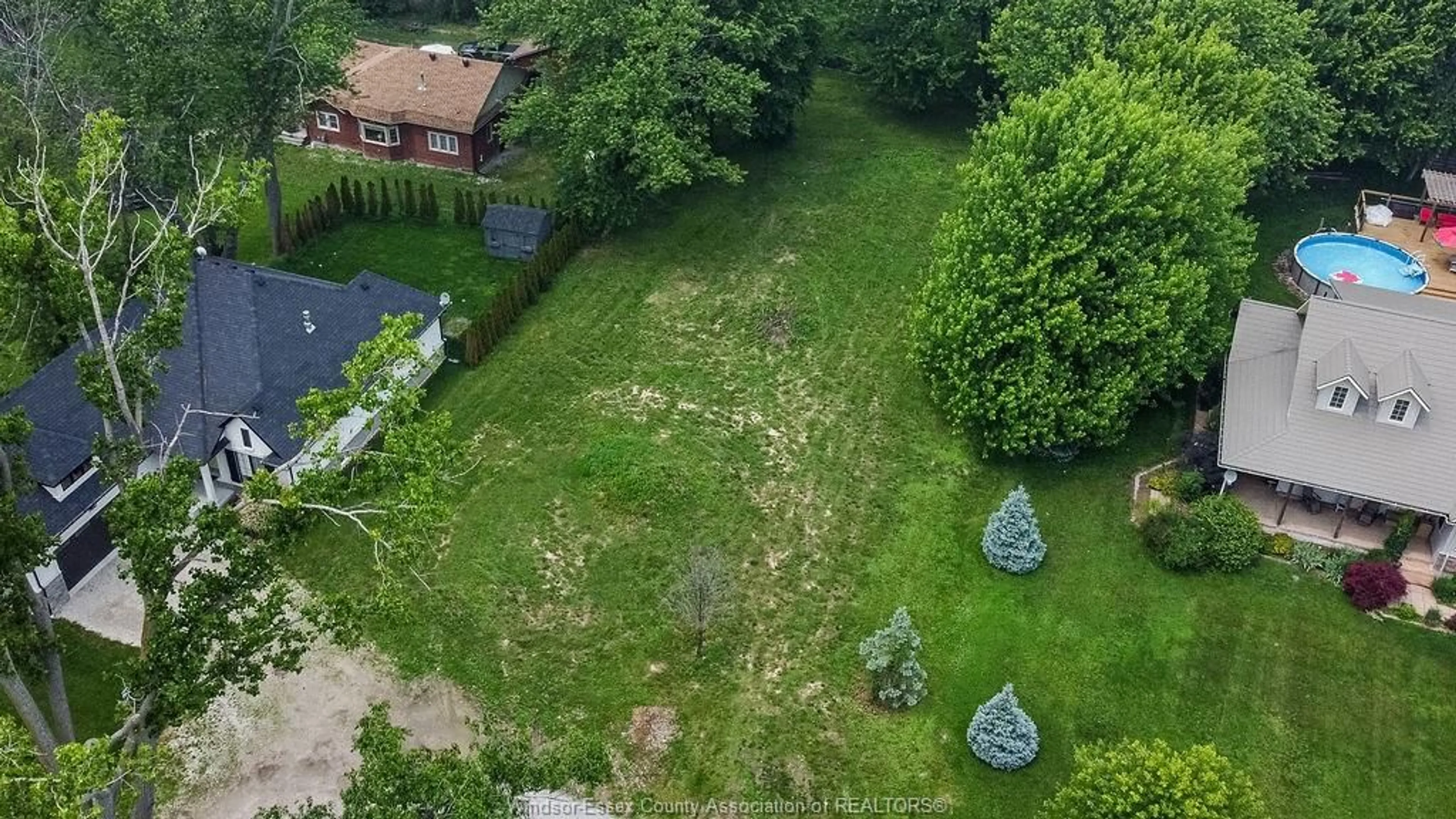 A pic from outside/outdoor area/front of a property/back of a property/a pic from drone, forest/trees view for 962 WATERS BEACH, Colchester Ontario N0R 1G0