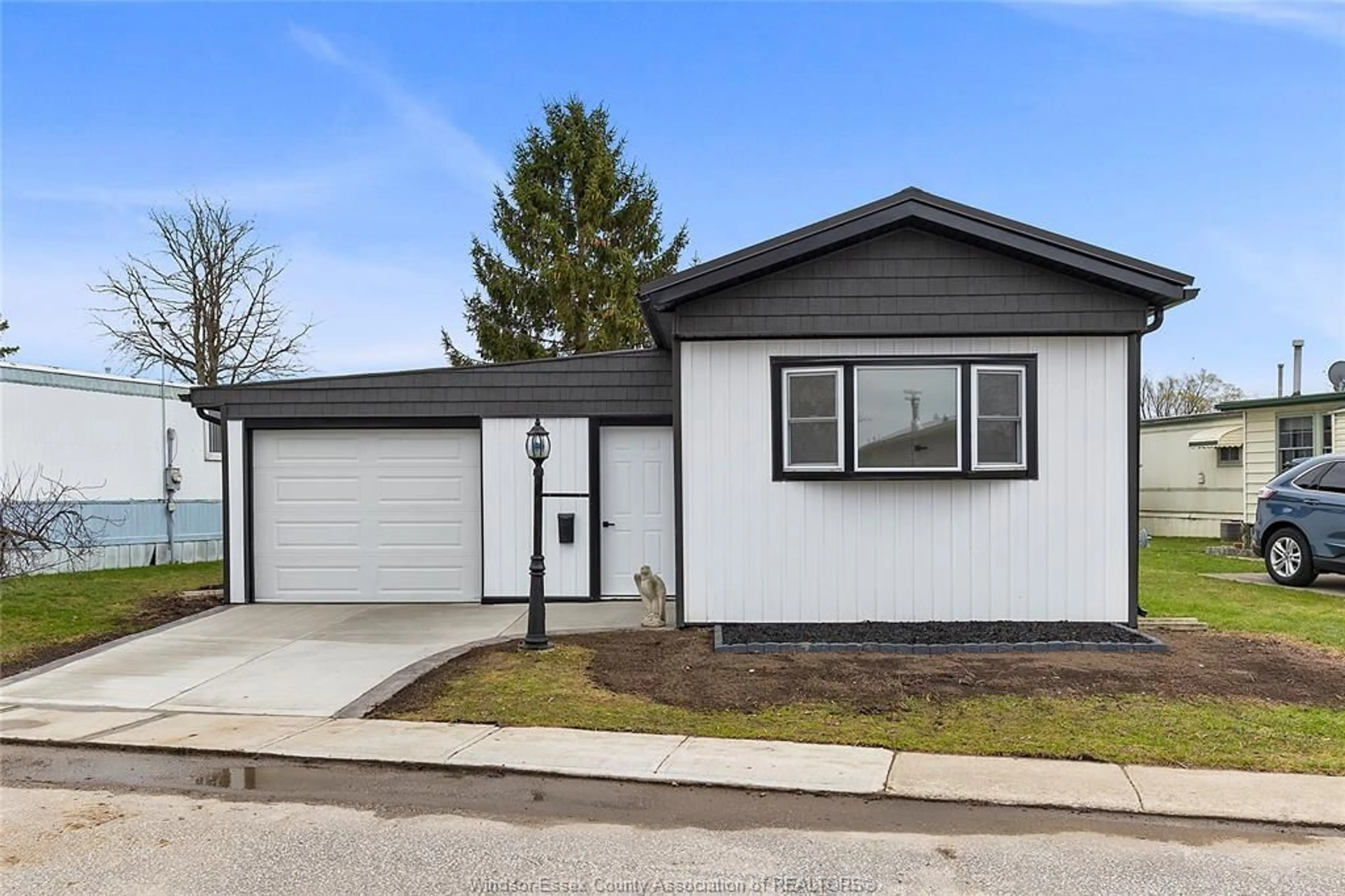 Home with vinyl exterior material, street for 83 MIRIAM, Essex Ontario N8M 1Z8