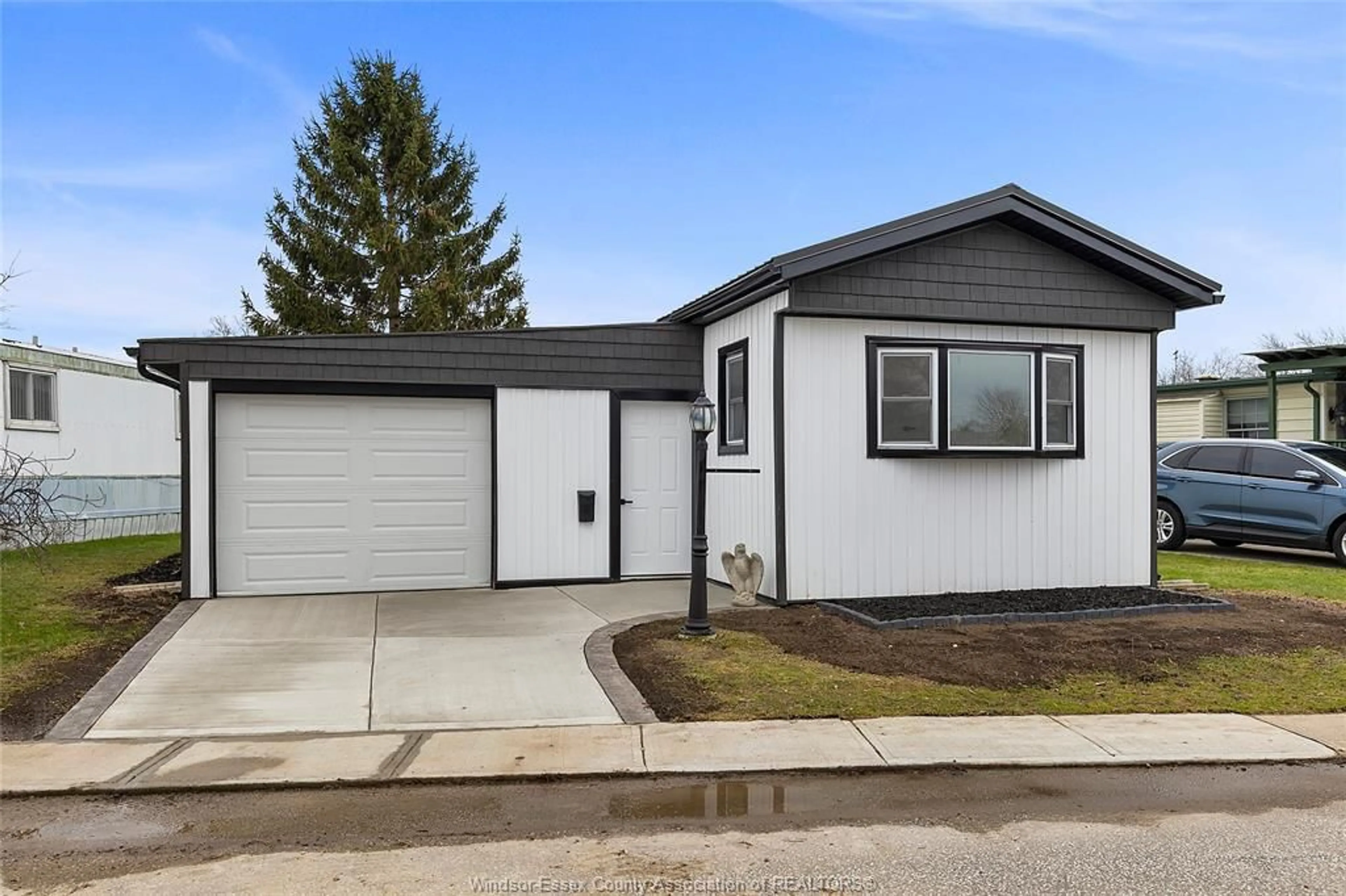 Home with vinyl exterior material, street for 83 MIRIAM, Essex Ontario N8M 1Z8