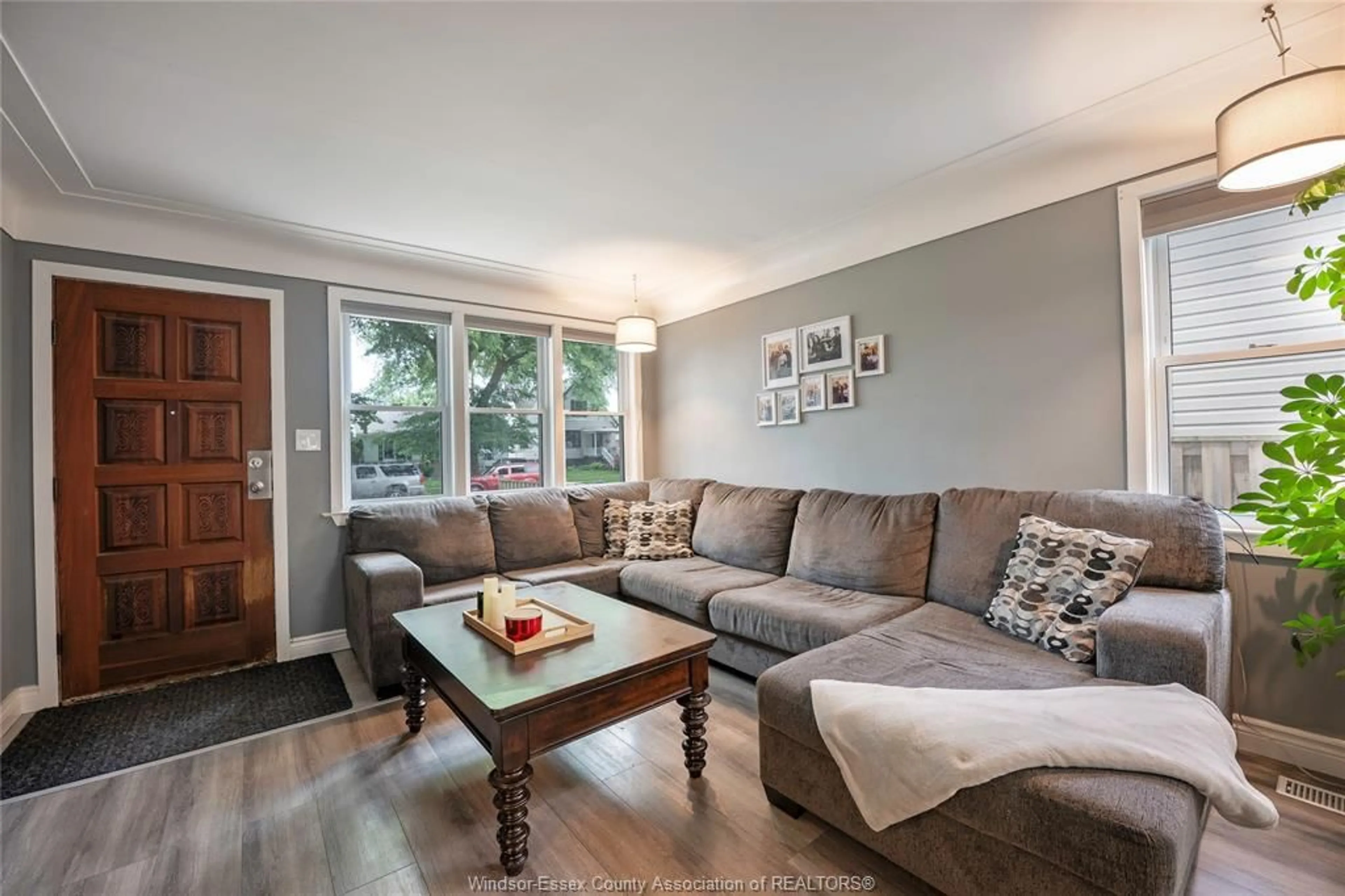 Living room with furniture, wood/laminate floor for 1892 Westminster Blvd, Windsor Ontario N8T 1X4