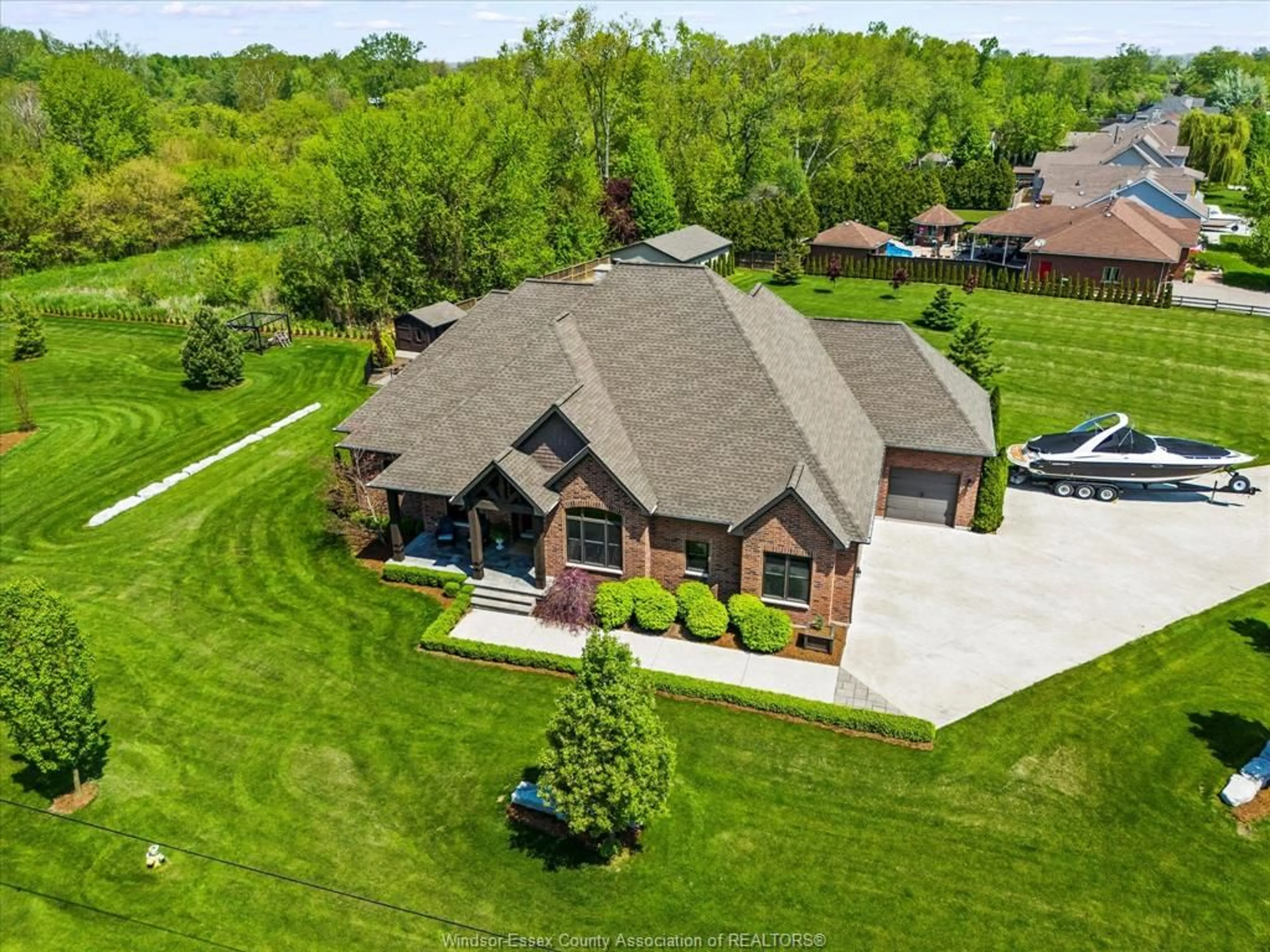 A pic from outside/outdoor area/front of a property/back of a property/a pic from drone, street for 36 Willow Beach Rd, Amherstburg Ontario N9V 2Y8