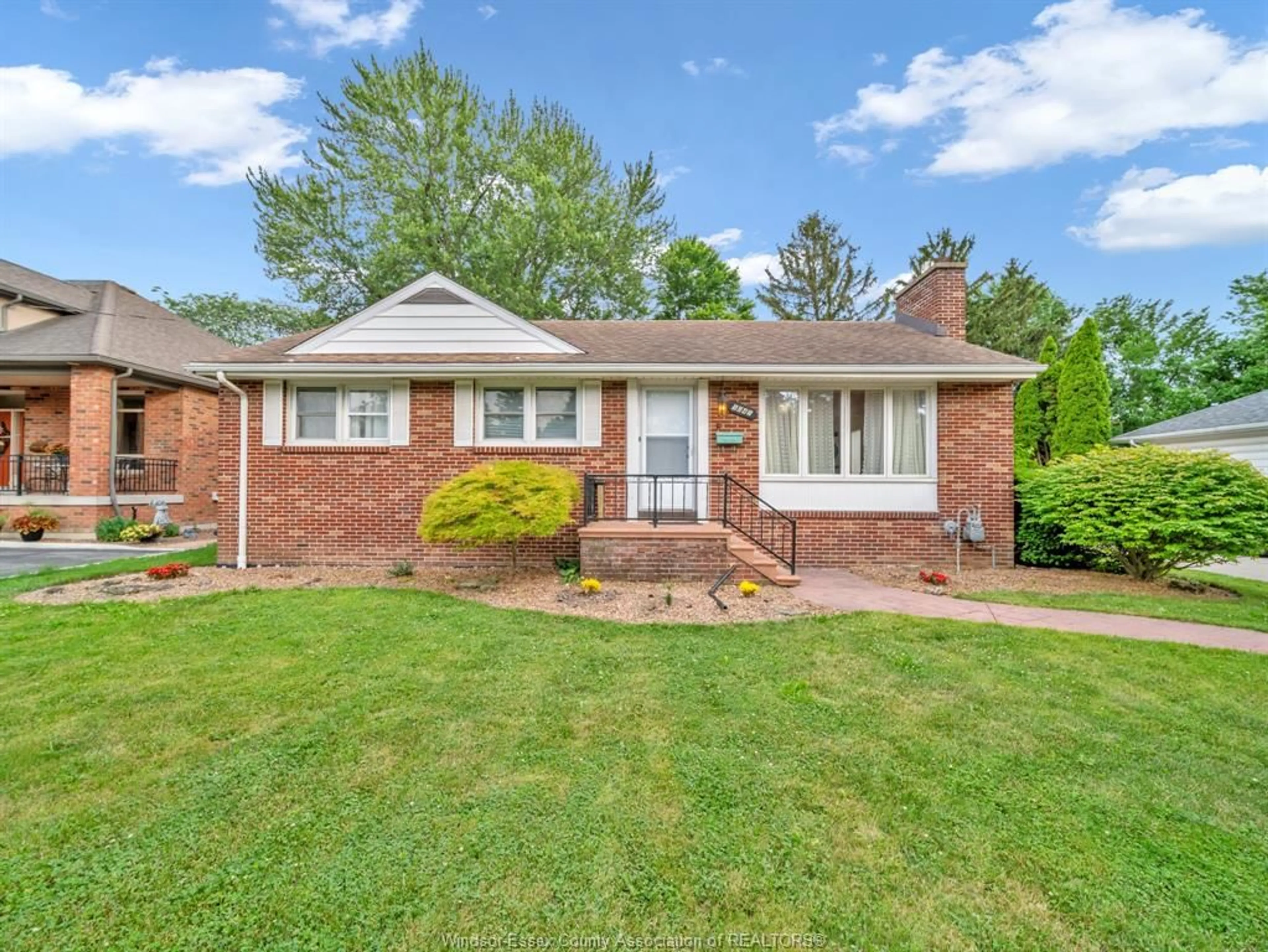 Home with brick exterior material, street for 1045 CABANA Rd, Windsor Ontario N9G 1B6
