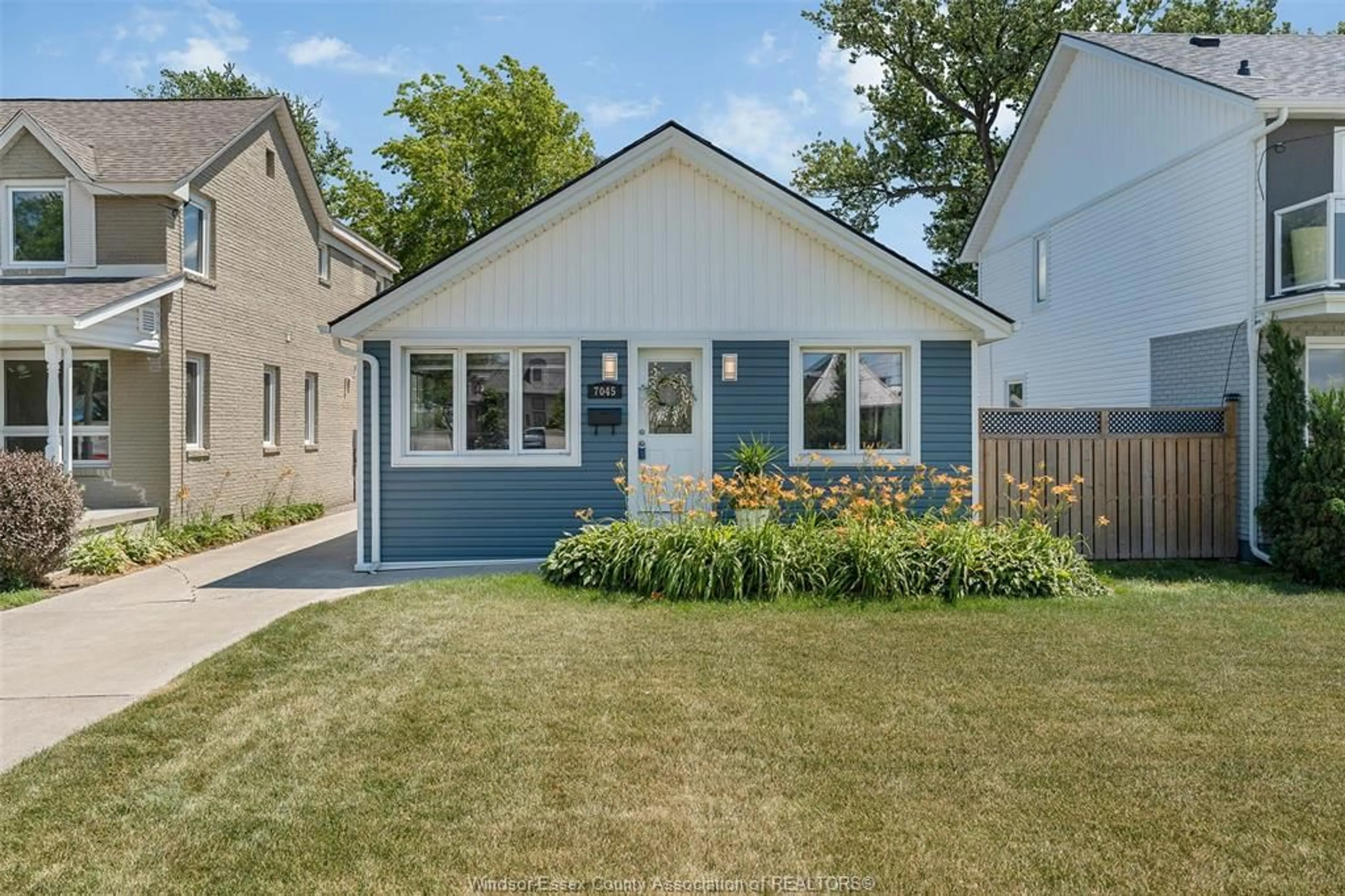 Home with vinyl exterior material, street for 7045 RIVERSIDE Dr, Windsor Ontario N8S 1C2