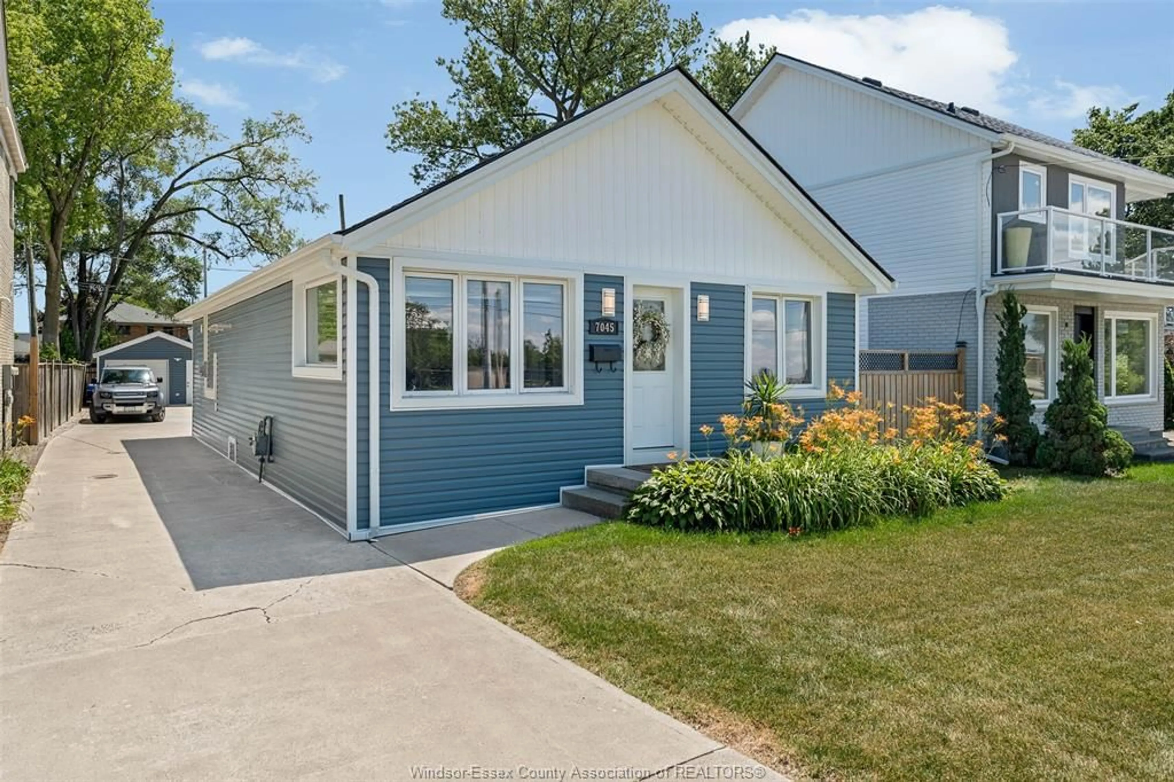 Home with vinyl exterior material, street for 7045 RIVERSIDE Dr, Windsor Ontario N8S 1C2