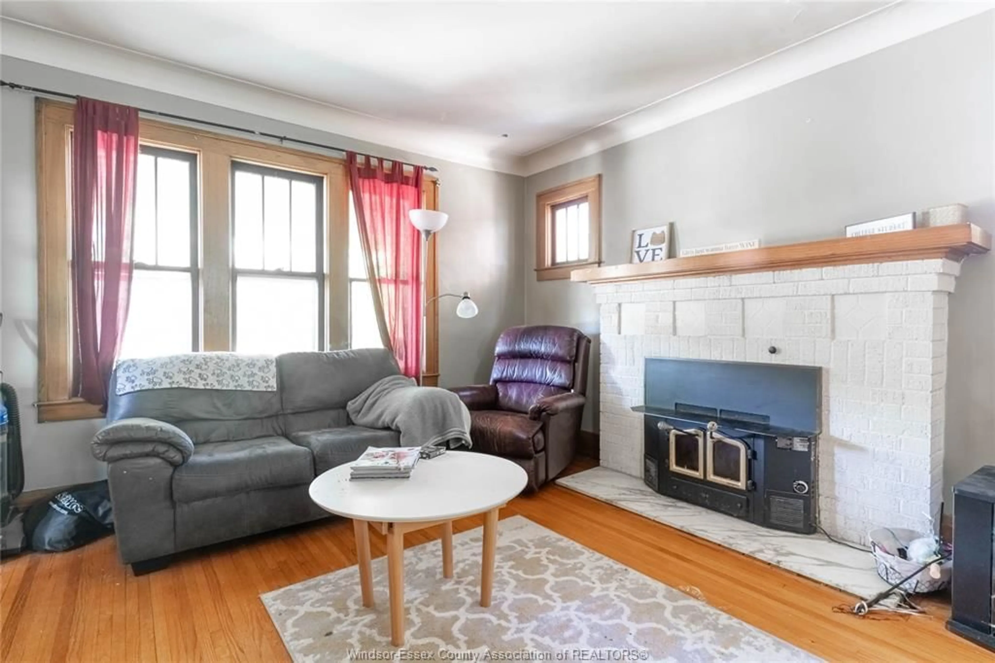 Living room with furniture, wood/laminate floor for 436 Partington, Windsor Ontario N9B 2N5