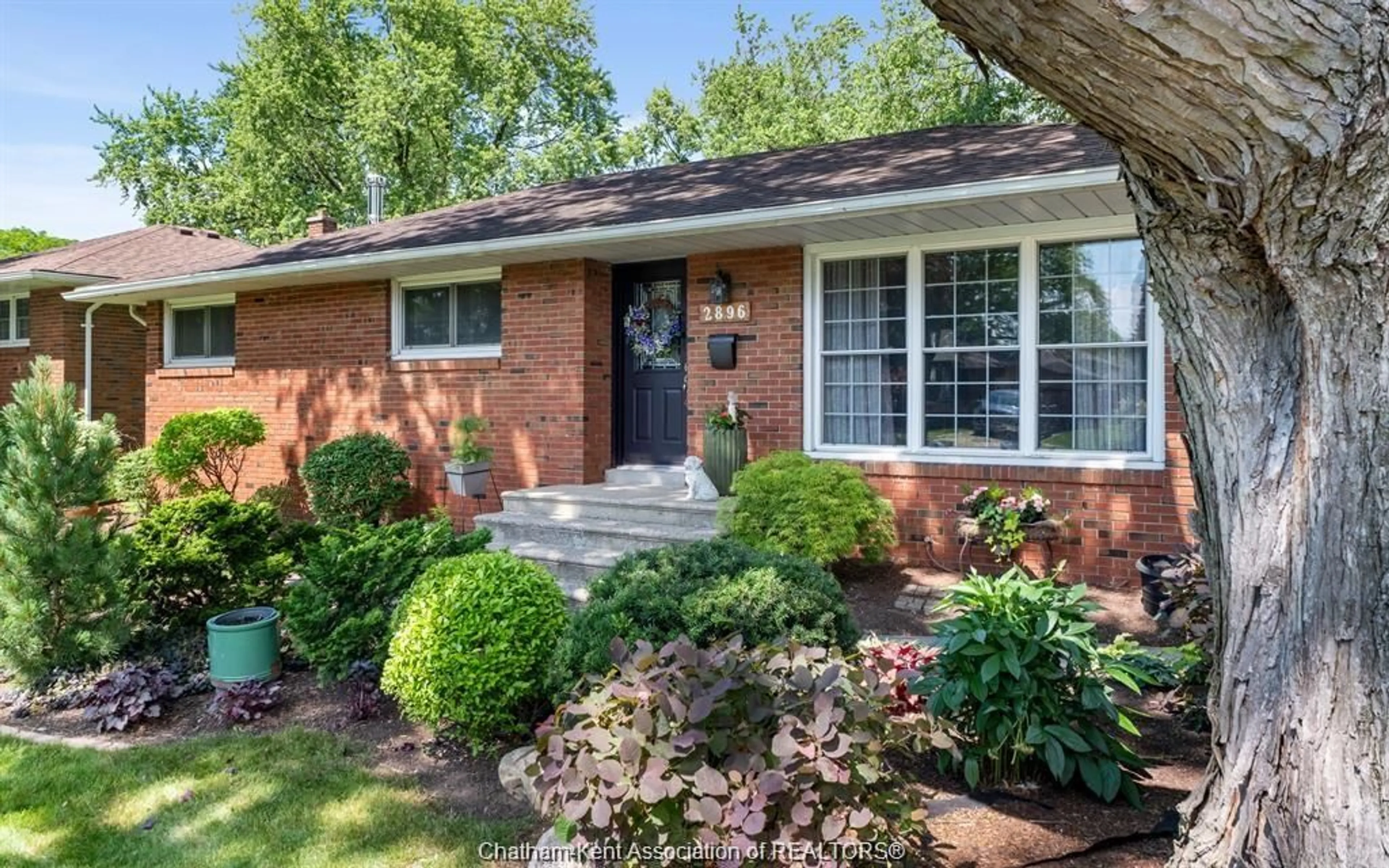 Home with brick exterior material, street for 2896 Radisson Ave, Windsor Ontario N9E 1Y3