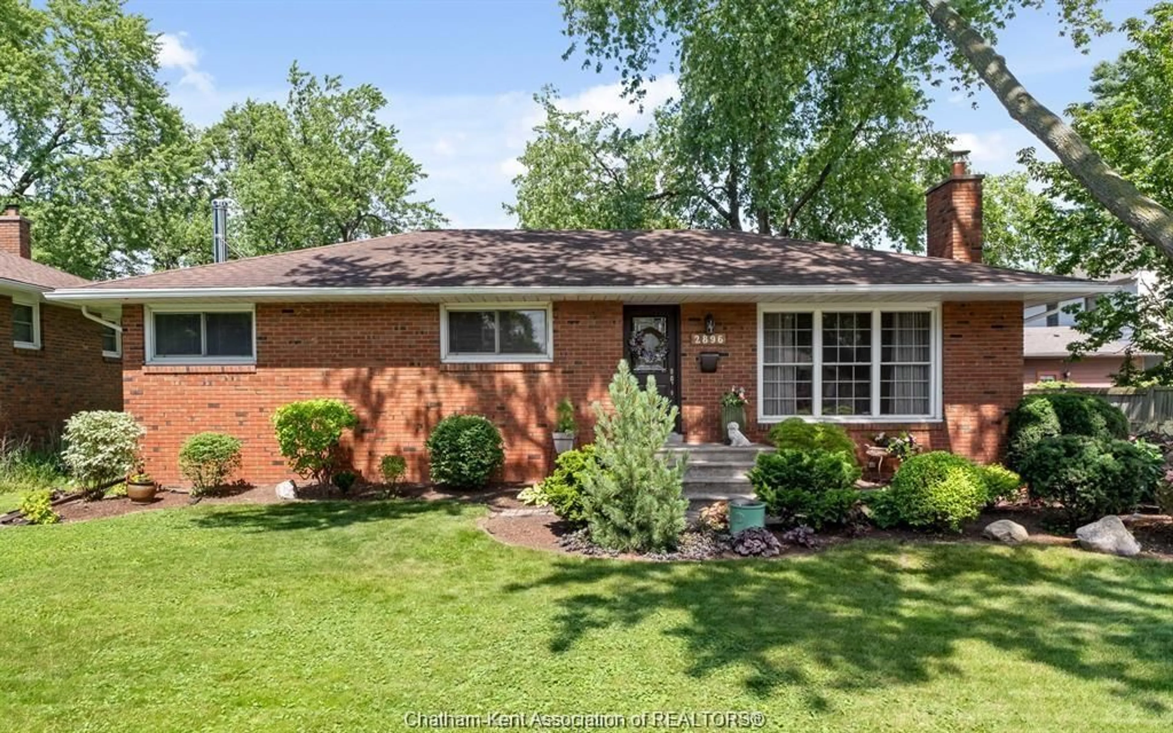 Home with brick exterior material, street for 2896 Radisson Ave, Windsor Ontario N9E 1Y3